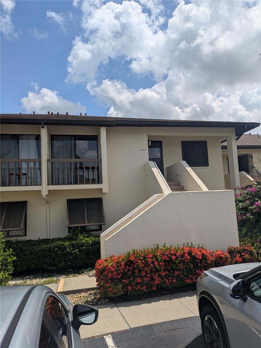 This SEASONAL/SHORT TERM TURNKEY condo is overlooking 2 ponds and a golf course, beautifully furnished and ready to rent. This 2-bedroom, 2-bathroom unit is located on the second floor and has been fully renovated with slab quartz countertops, solid wood cabinetry, stainless steel appliances, a butler's pantry, laminate and tile flooring, and a walk-in shower in the guest bathroom. The primary bedroom has a queen bed while the guest room has two single beds, perfect for entertaining guests. The screened-in lanai offers a great opportunity to catch a sunset over the water view. The subdivision offers 2 heated pools and a variety of social activities provided by the HOA. The unit offers a fantastic location for shopping or heading out to any of the award-winning beaches in the area. You haven't experienced how wonderful winter can be until you spent it living the Florida lifestyle.