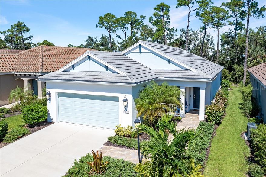 Effortless Living Awaits in Indigo at Lakewood Ranch - Discover the perfect balance of comfort, style, and convenience in this beautifully maintained Patriot home by Neal Communities. Built in 2022 and nestled on a private PRESERVE LOT, this thoughtfully designed residence offers 3 BEDROOMS, 2 BATHROOMS and a flexible DEN — ideal for a home office, hobby room, or guest space. 

The open-concept floor plan is loaded with meticulously selected upgrades. IMPACT WINDOWS AND SLIDERS provide peace of mind for all seasons. Plank TILE flooring seamlessly connects the main living area, kitchen, and dining space.  You’ll love the stylishly MODERN KITCHEN featuring quartz countertops, backsplash tile, a gas oven range, upgraded appliance package, 42” cabinetry, pots & pan drawers, and a spacious island that’s perfect for entertaining.

Retreat to the serene OWNER’S SUITE featuring a walk-in shower, dual vanities, and a large closet. Guests enjoy their own private wing with two bedrooms and a full bath at the front of the home. 8 ft Hurricane-impact sliding doors lead to an OVERSIZED SCREENED LANAI overlooking tranquil preserve views (the coveted “no rooftop” view).  Prepare a freshly grilled meal on the OUTDOOR KITCHEN and relax at the grill island, the perfect place to unwind or enjoy your morning coffee.  

This home has several practical features that also deserve a nod: There’s plenty of parking in your TWO CAR garage;  a TILE ROOF is both aesthetically beautiful and provides protection from the elements; and a dedicated separate LAUNDRY ROOM keeps the necessary chores within easy reach.

Located in the gated, maintenance-free COMMUNITY of INDIGO, residents enjoy resort-style amenities including a clubhouse, fitness center, tropical pool and spa, pickleball and bocce courts, and a full-time lifestyle director who plans year-round social events. Just minutes from Lakewood Ranch’s shopping, dining, golf, and Gulf Coast beaches, this home makes everyday living feel like a getaway.
Enjoy the easy Florida lifestyle you’ve been dreaming of — schedule your private showing today!