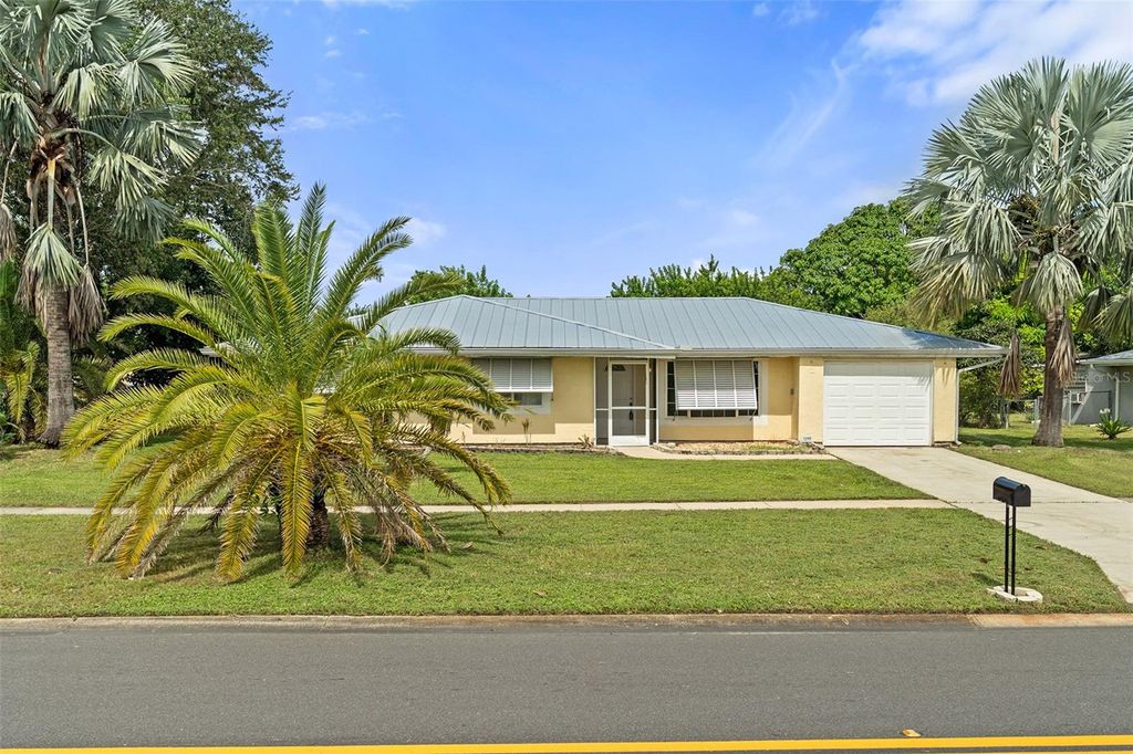 Photo of 1340 Mariposa Drive NE, Palm Bay, FL 32905 (MLS # O6343659)