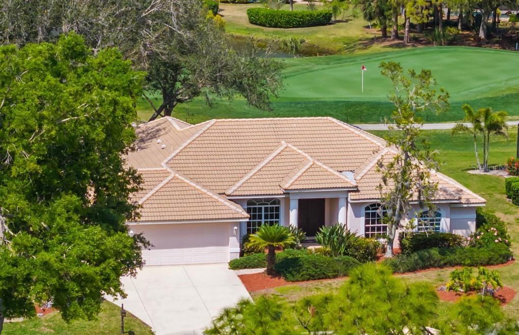Stunning Golf Course POOL Home with NEW PRICE & $10,000 Buyer Credit! Now is your chance to own a beautifully maintained home in a premier location—seller is offering a $10,000 credit at closing-Use it toward closing costs or customize the home to your taste—the choice is yours!
Welcome to your Florida dream home! This beautifully maintained 4/5 bedroom, 3-bathroom pool home with a versatile flex room sits proudly on the 5th hole of the Calusa Lakes Golf Course, nestled within the highly desirable gated community of Calusa Lakes in Nokomis.
From the moment you step through the elegant double doors, you’re welcomed by soaring ceilings, abundant natural light & stunning views of the pool & lush fairway just beyond. The thoughtfully designed floor plan offers nearly 2,500 square feet of refined yet comfortable living space, with an additional flex room perfect for a home office, den, or even a fifth bedroom.
At the heart of the home is a spacious kitchen featuring extensive cabinetry, expansive counter space, a dry bar, double ovens & ample storage, making it a chef’s delight. The charming breakfast nook overlooks the tranquil screened-in pool & the rolling greens of the golf course—an ideal setting to start your day.
The luxurious primary suite provides a peaceful retreat with two large walk-in closets, dual vanities, a spa-style soaking tub & a walk-in shower. Large sliding glass doors from the main living areas invite you to relax or entertain outdoors in your private lanai & pool oasis, where you’ll enjoy panoramic views of the fifth hole & serene Florida sunsets.
The oversized three-car garage offers plenty of room for vehicles, golf carts, or extra storage. The home is situated on a generously sized lot with tropical landscaping, expansive lanai with beautiful pool, combining beauty & space.
Calusa Lakes offers residents low HOA fees, no CDD fees, a semi-private golf club & tennis courts, all in a pristine & beautifully-maintained setting. Ideally located just minutes from Nokomis Beach, the Legacy Trail, historic downtown Venice, I-75, Honore Avenue, top-rated medical facilities, shopping & restaurants - this home provides the perfect balance of tranquility and convenience.
Don’t miss this rare opportunity to own a luxury golf course pool home in one of Nokomis’ most sought-after communities. Florida living starts now!!!