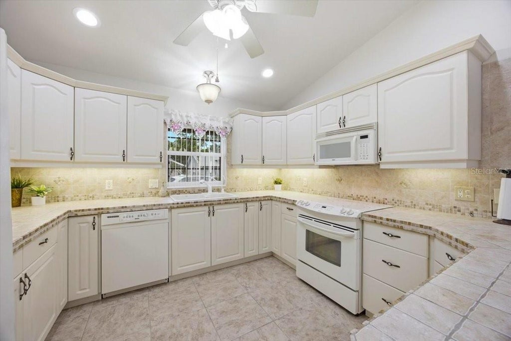 Photo of 477 Sweetwater Way, Haines City, FL 33844 (MLS # O6431674)