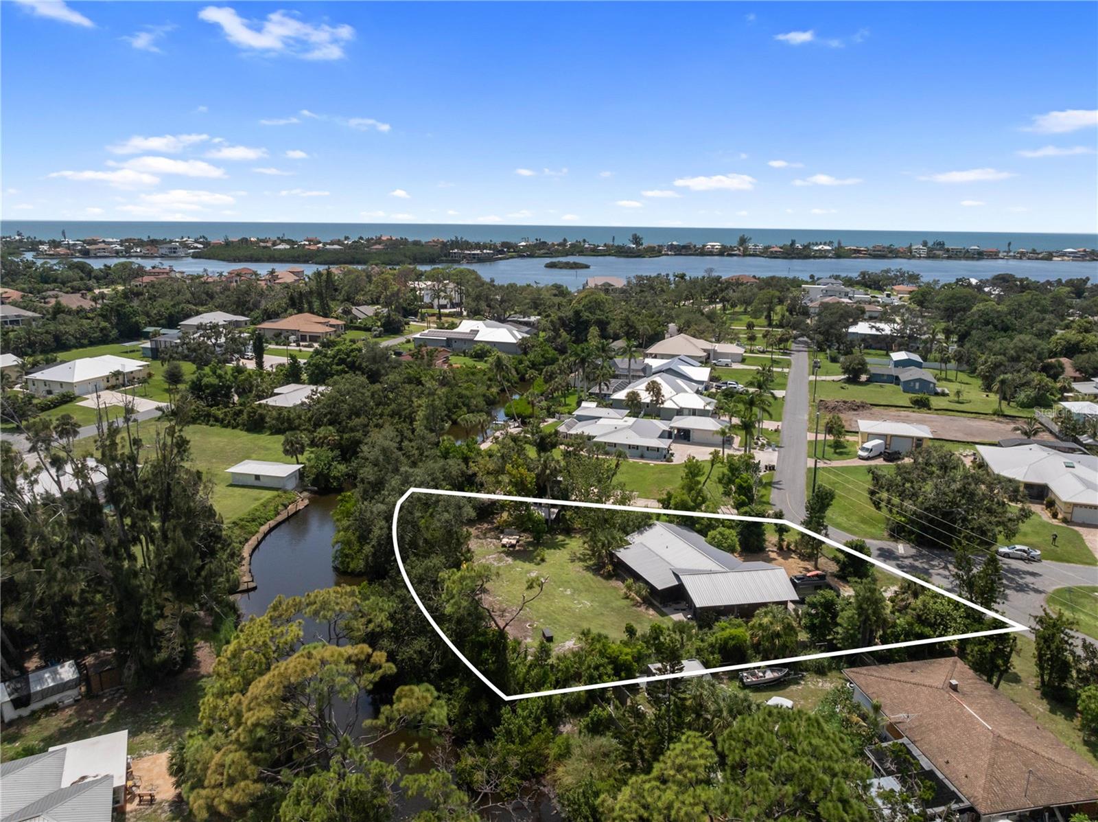 Waterfront Living Just Minutes to the Intracoastal!
Welcome to 217 Charles Drive, a charming 2-bedroom, 2-bath waterfront cottage nestled on nearly half an acre in the heart of Nokomis. This unique home offers the perfect blend of Old Florida character and modern possibilities, with direct canal access and only six homesites separating you from Blackburn Bay and the Intracoastal Waterway.
Situated on an impressive 172 feet of waterfront, this property features a private dock complete with water and electricity, ideal for boating, fishing, and enjoying Sarasota’s coastal lifestyle. The oversized garage provides ample room for cars, a boat, or additional storage, while the 31-foot lanai invites you to relax and soak in peaceful water views year-round.
Inside, the home’s open layout creates an inviting flow from the kitchen to the living and dining areas, making it easy to entertain. Built in 1979 with timeless cedar siding and a durable metal roof, the home has been thoughtfully designed with both function and charm in mind. A detached shed adds extra storage space for tools, kayaks, or outdoor gear.
Perfect as a full-time residence, seasonal retreat, or future dream-home site, this property offers endless opportunities. With nearly half an acre of land, lush natural surroundings, and quick access to Nokomis Beach, Venice, and Sarasota, it’s an unbeatable location for anyone who wants to enjoy the Gulf Coast lifestyle.
Don’t miss this rare chance to own waterfront property in one of Nokomis’ most desirable boating communities.