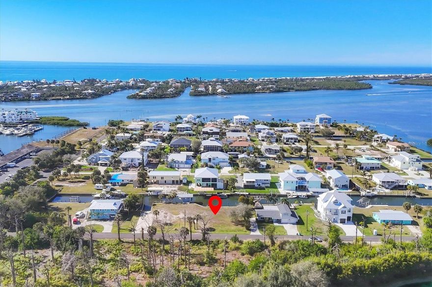 Unique opportunity to own a cleared .46-acre buildable DOUBLE LOT in Palm Point with DIRECT ACCESS to the ICW and Gulf with NO bridges to navigate by boat!  This is not just vacant lots on a canal… Lot 9 comes with your own Private BOAT RAMP, a DOCK, a Boat LIFT and WATERFRONT shoreline featuring professionally installed riprap with a reinforced concrete cap, providing long-term erosion protection and a clean, finished appearance.  The boat lift capacity is 12,000 to 15,000 lbs. with a new heavy duty hoist bottom and is supported by stainless steel pilings.  Lot 8 has a new 90 Foot concrete SEAWALL and 5 new Mooring Pilings.  This lot offers a generous BASIN with ample dockage for large watercraft up to about 40 Feet.   Prefer to not own a boat and maybe rent out your boating spaces, there is no HOA to contend with in this nook of Englewood.  
Planning ahead and considering turning this amazing retreat into an AIRBNB?   Your guests are steps away from the Cape Haze Marina and Freedom Boat Club and just minutes away by boat or in vehicle to numerous Tiki Bars, Restaurants, Live Entertainment, Fishing, Golfing and Beaches.  Boating enthusiasts ...Don’t hesitate on this rare opportunity to design your ultimate waterfront retreat in Paradise!  
Amazing opportunity to design your new custom-built home on a blank slate.  Plenty of room to add a circular driveway and angle the pool side of your home facing our stunning SW Florida sunsets.  End your day by sitting on your sundeck or taking a sunset boat ride out to Stump Pass.   Love privacy and wildlife?  On the frontside of your property you are facing Raymond Street. Embrace the serene woodlands and the sounds of nature.  This land is located at the end of owned of a local golf course.  Make your offer soon!