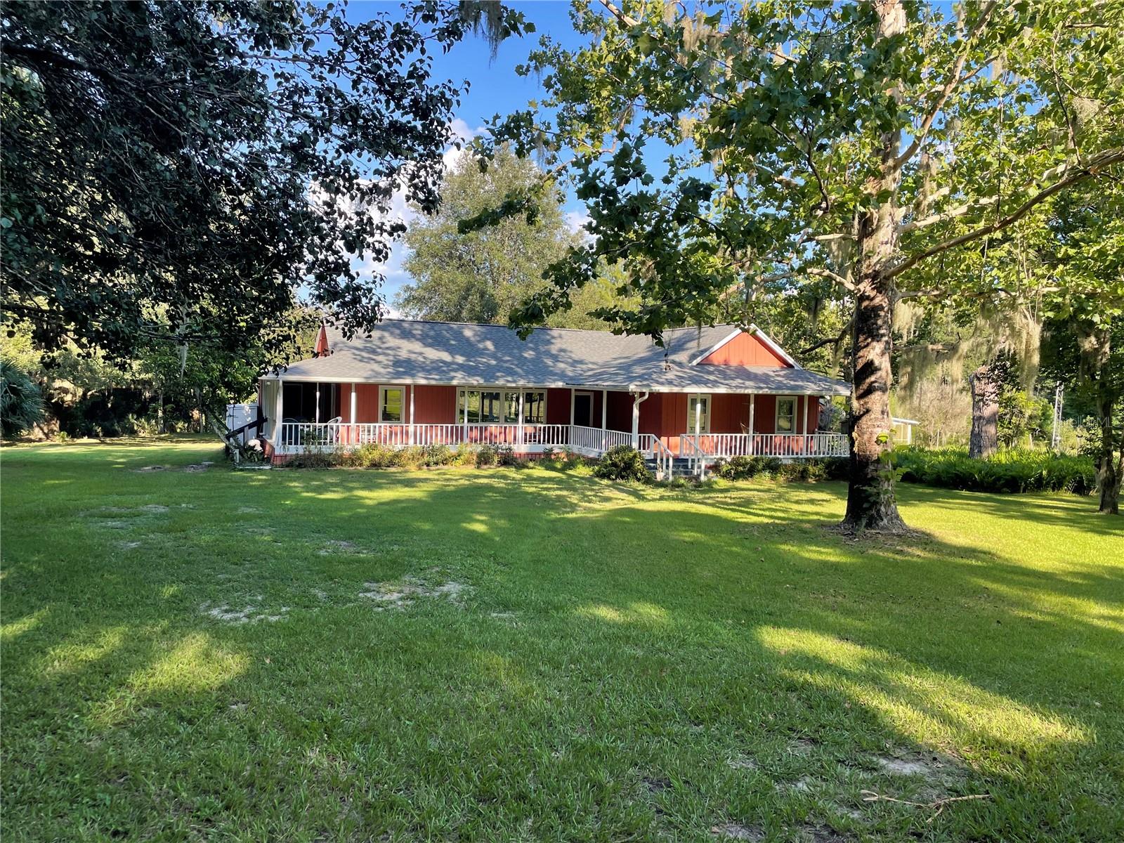 Ideal for horse owners, equine professionals, outdoor enthusiasts, gardeners, graduate or
veterinary undergrads seeking space, privacy, and convenience, this beautiful 3-bedroom, 2.5-bath
custom home is situated on nearly 30 acres with 10+ fenced acres of pasture in Micanopy, just 20 minutes from Gainesville,
UF, and the College of Veterinary Medicine.
With over 2,000 sq ft of thoughtfully designed living space, this home features an open floor
plan, spacious bedrooms, and abundant natural light—perfect for those seeking space, serenity,
and flexibility. Whether you're a professional needing proximity to UF/Shands or an equestrian
looking for move-in-ready facilities, this property offers the best of country living with easy
access to I-75, Gainesville, and Ocala.
Highlights include: Horse amenities: Large 4-stall barn with two stalls having access to a 12x30ft outdoor
run, outdoor wash rack, cross tie working stall, 1-acre run paddock with stall, 4-acre
paddock with run-in shelter—ideal for horses or small livestock.
Chef’s kitchen with butcher block and concrete countertops, stainless steel appliances,
and custom cabinetry.
Open-concept living and dining areas with beautiful wood flooring.
Expansive primary suite with two large closets and updated bathroom featuring a large
shower.
Guest room with private bath, ideal for visitors or a home office/study.
Covered wrap-around patio, perfect for relaxing or entertaining with views of the
surrounding woods and pasture.
Laundry area with washer and dryer conveniently located off the kitchen.
Detached art studio that is climate-controlled and so much natural light.
Garden-ready planters and land to grow fruits and vegetables.
Peaceful, wooded lot with fenced acreage offering privacy, space, and a connection to
nature.
Private 10-acre area with maintained trails (weather permitting).
This property is a unique opportunity for those looking to live close to nature while maintaining
proximity to town, work, or school. This space offers versatility, comfort, and privacy for anyone
who has a green thumb and enjoys the outdoors.