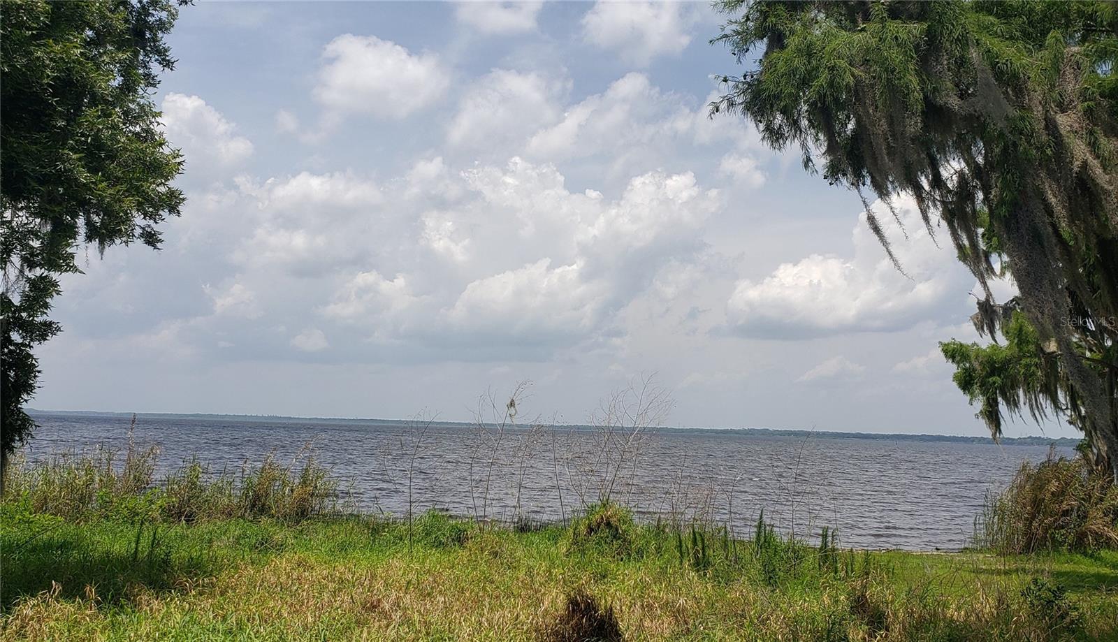 SELLER FINANCING AVAILABLE! Looking for the perfect waterfront property to build your custom dream home? Your wait is over! This prime Lake Monroe lot offers over 1 acre of land and approximately 114 feet of direct lake frontage—with NO canal or canal access to obstruct your view or limit your dock design.
Enjoy expansive, unobstructed views of Lake Monroe - among the deepest and most breathtaking in the area. With such a wide and deep lot, you’ll have enhanced privacy and space between neighboring homes.
This site is verified build-ready: fill dirt has already been brought in, and custom home plans can be included with the purchase.
Picture yourself watching Sanford’s famous Downtown Fireworks Show from your backyard - OR your boat! Just across the lake lies Historic Downtown Sanford, home to top-rated restaurants, unique shops, and a vibrant community. Nearby, enjoy the natural beauty of Mariner’s Cove Park, Green Springs, and the bike trail.
Opportunities like this are rare—don’t miss your chance to own a slice of paradise right on Lake Monroe. Call today for more information.