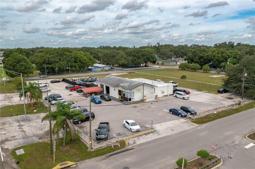 TREMENDOUS OPPORTUNITY! This 2.15 Acre commercial property is perfectly situated between SR-Hwy. 17-92 and US Hwy. 27. High Traffic Count, Direct Visibility and 285’ Frontage on Hwy 17-92 delivers an outstanding opportunity for most any business venture. This Rare Find provides 3,749 total sq ft of offices, restrooms, garages: along with carports and an abundance of paved parking. This block of property is totally fenced with easy access from all directions, highway and side streets. A great feature of this property is the sizable open yard that is ideal for expansion and development to meet the needs of your business. This one-of-a-kind, HIGHLY VISIBLE 2.15-Acre lot won’t last long in this rapidly growing Central Florida area, so call today!