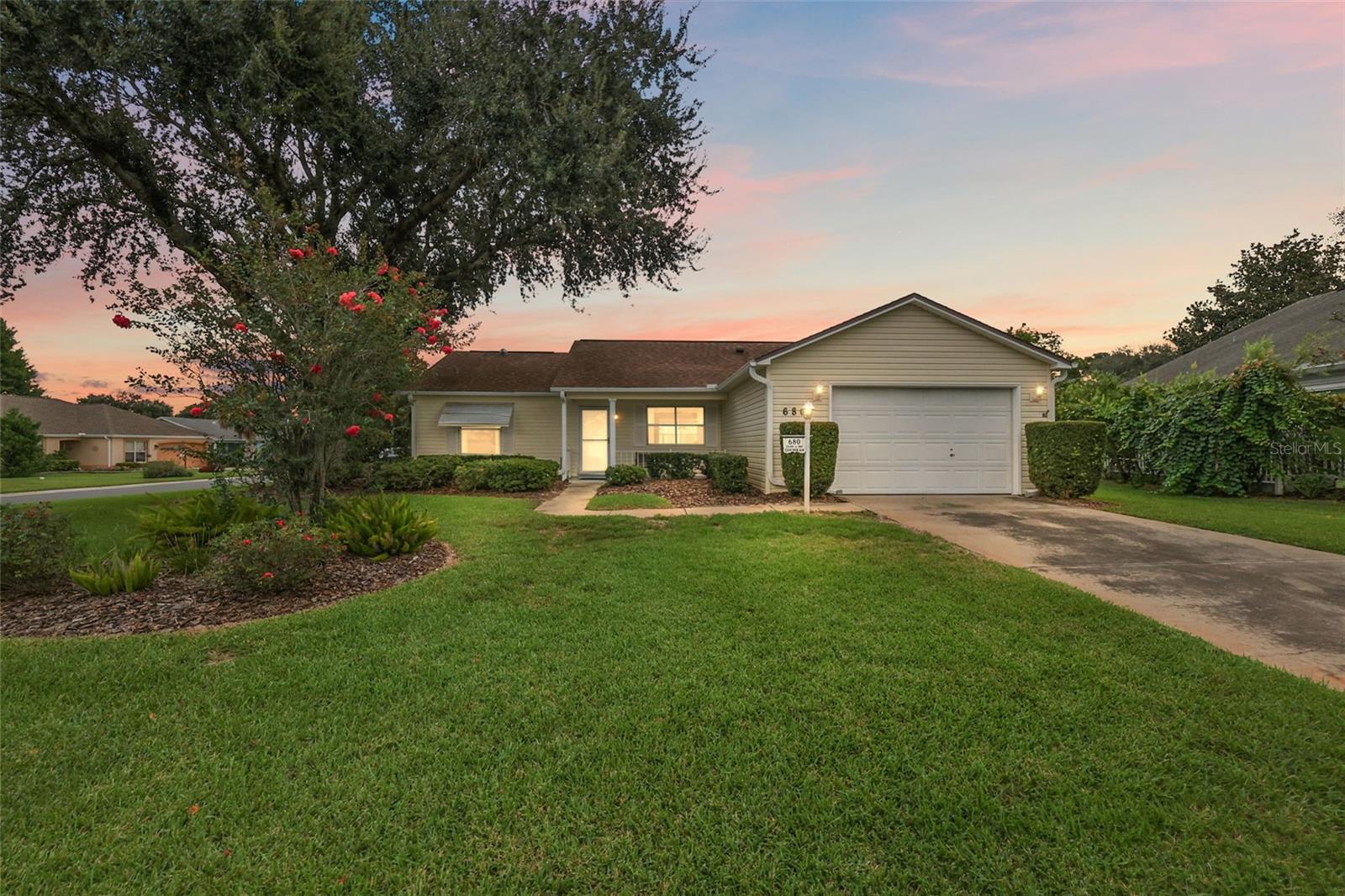 Fantastic TURNKEY 2/2 Laramie with WONDERFUL UNDER-AIR FLORIDA ROOM and extended BIRDCAGE on LARGE CORNER LOT, CONVENIENTLY LOCATED in the quaint Village of Rio Grande! JUST MINUTES to BOTH Spanish Springs Town Square and Lake Sumter Landing! BOND PAID! A lovely front porch and mature landscaping, and LEAF FILTER add to the exterior charm of this AMAZING home!
Step inside to discover the SPECTACULAR OPEN CONCEPT FLOOR PLAN of the living and dining areas featuring high VAULTED ceilings. Just off of the dining room is a FABULOUS CLIMATE-CONTROLLED FLORIDA ROOM with a plethora of windows for ABUNDANT NATURAL LIGHT. This VERSATILE ROOM offers the ideal space for a den, media room, or home office. An exterior door opens to the adjacent BIRDCAGE and REAR PATIO - perfect for grilling, or simply RELAXING and enjoying the beautiful Florida sunshine! Back inside, the beautiful kitchen boasts cabinetry PULL-OUTS, BLACK STAINLESS refrigerator and oven, EAT-IN breakfast bar, and an adjacent FAMILY ROOM creating a wonderful space for RELAXING or ENTERTAINING friends and family! The primary bedroom offers TWO CLOSETS and an EN-SUITE bathroom boasting a WALK-IN shower. Designed for privacy, the SPLIT FLOOR PLAN places an additional bedroom with a built-in closet at the front of the home. The second bathroom features a tub/shower combination and hallway LINEN closet for added storage. There’s also an additional storage closet near the foyer. An INTERIOR LAUNDRY room with shelving and a utility sink provides both functionality and convenience. Directly off of the laundry room you will find a SPACIOUS 18’x22’ garage offering shelving, attic access with stairs, additional refrigerator and freezer, an exterior door to the side yard, and plenty of room for parking! DON’T MISS THE OPPORTUNITY TO MAKE THIS INCREDIBLE HOME YOUR OWN! Located just 1/2 mile to the Rio Grande Neighborhood Pool and minutes to County Road 466 with with an abundance of shopping, restaurants, banks, medical and more! Close to three large Regional Recreation Centers: Laurel Manor (7 min.), Savannah Center (9 min.) and La Hacienda (4 min.); several Country Clubs and Championship Golf Courses: Tierra Del Sol (4 min.), Hacienda Hills (3 min.) and Orange Blossom Hills (7 min.). PLEASE WATCH OUR WALKTHROUGH VIDEO OF THIS WONDERFUL TURNKEY HOME in an AMAZING LOCATION and CALL TODAY to schedule your Private Showing or Virtual Tour!