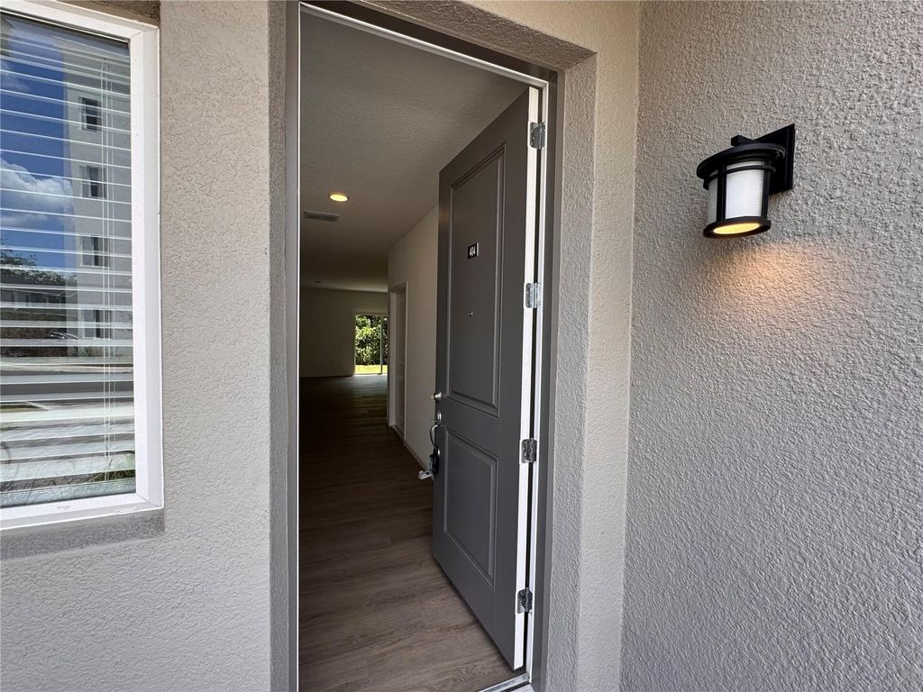 Photo of 1213 Southstation Place #404, Orlando, FL 32809 (MLS # O6385621)