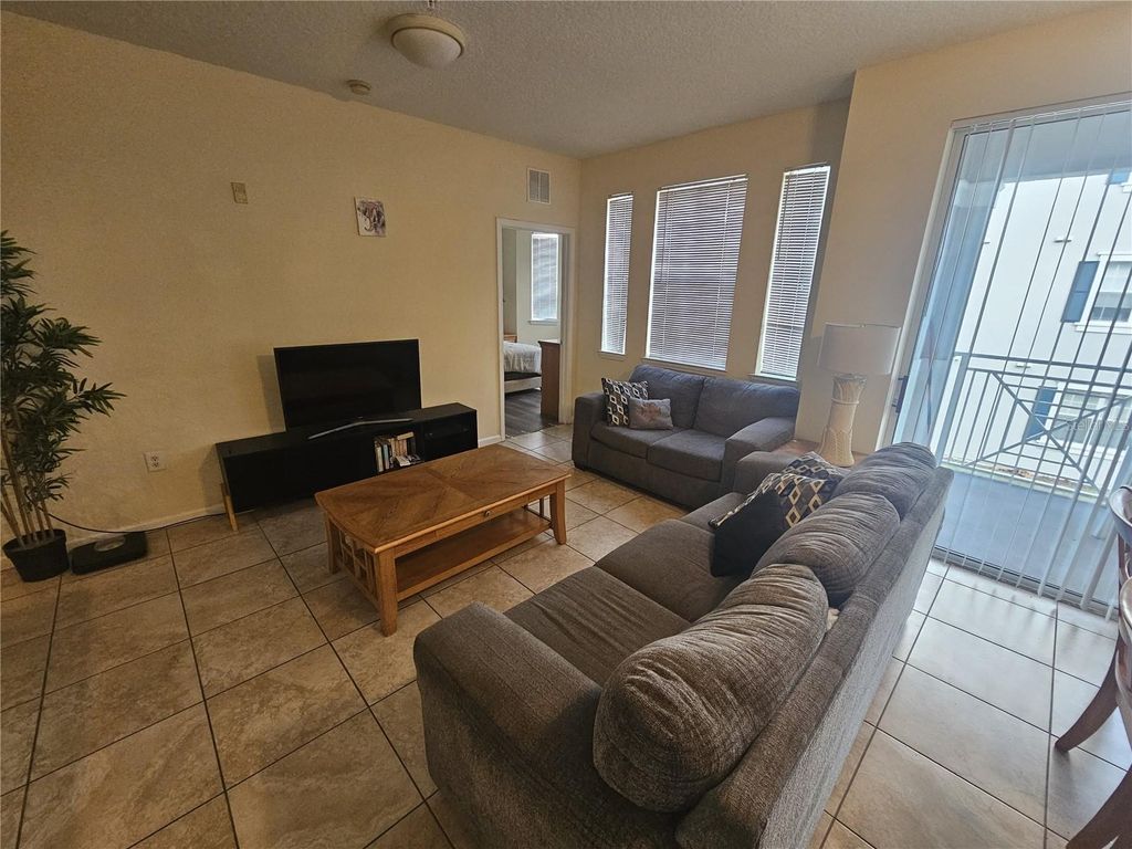 Photo of 5255 Cane Island Loop #204, Kissimmee, FL 34746 (MLS # O6380910)