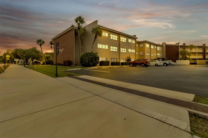 FIRST FLOOR unit at The Plaza View. A LARGE one bedroom, 1 bath unit with a bonus room has been freshly painted and new laminate flooring one year ago.  The unit comes with a dedicated parking space and there are several guest parking spots too.  Exterior windows are impact resistant and FEMA shows that it is NOT IN A FLOOD ZONE (X).   Conveniently located in the Parkside District, you are close to hospitals, shopping, grocery stores, restaurants and recreational activities such as boating, fishing, golfing, Charlotte Harbor access & pickleball courts.  Enjoy the community pool and laundry facilities as well as locked access entry points. Only residents and their guests can access the property. There are a few common areas to relax and converse with your friends & neighbors as well as a few pieces of exercise equipment for resident usage. This unit is currently leased, expiring 5/31/26. While there is a one-year minimum ownership for rentals, a new owner can take over the lease and continue to enjoy monthly income. Basic cable, wifi & water/sewer is included in the monthly fee.   Several Gulf beaches are approximately 45 minutes away. Fishermen's Village & downtown Punta Gorda is approximately 12 minutes south and Sunseeker Resort is just before that. GREAT OPTIONS FOR ENTERTAINMENT AND FIRST CLASS DINING.