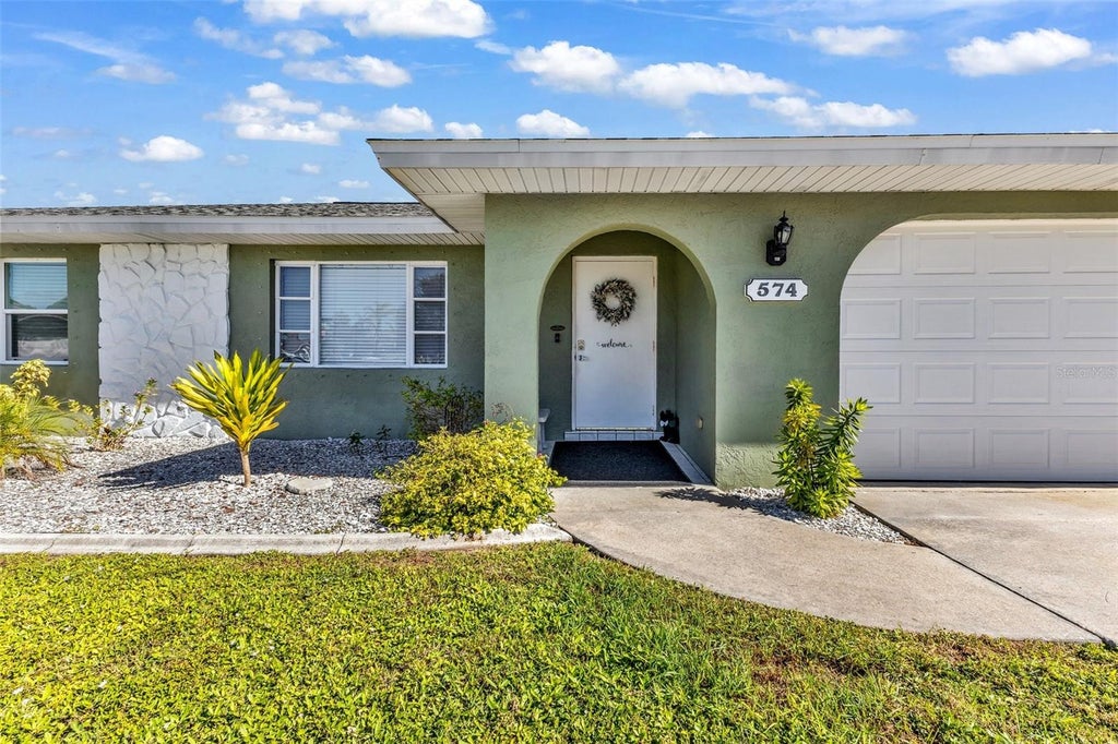 Photo of 574 Azalea Avenue NW, Port Charlotte, FL 33952 (MLS # C7532262)