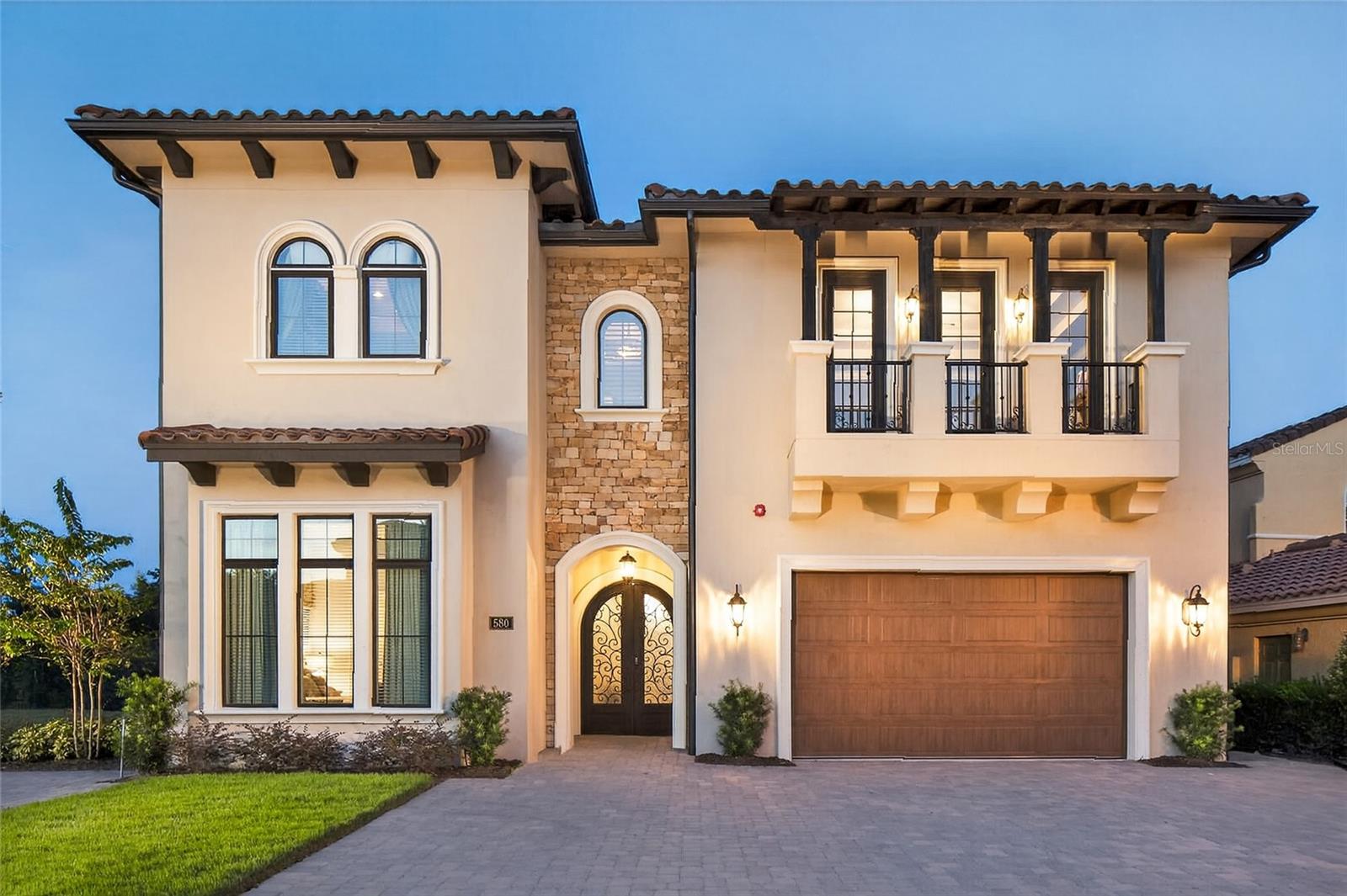 **Reunion Membership Available with this Home**
Reunion Resort’s showstopper on Muirfield Loop at Legends Corner.
Welcome to 580 Muirfield Loop, a one-of-a-kind, designer-crafted 9BR/11BA ~6,800 SF luxury retreat where resort living meets pure imagination. Set on Reunion’s prestigious Muirfield Loop—just ~6 miles to Walt Disney World—this residence is equal parts sanctuary and spectacle, created for unforgettable gatherings and effortless indoor–outdoor living.
Step into a soaring, open-concept great room that flows to a chef’s kitchen (oversized breakfast bar, premium appliances) and a 16-seat dining area—perfect for celebrations. Floor-to-ceiling glass doors disappear to reveal a private pool & spa, summer kitchen, fire pit, lazy river, and preserved views on one of the largest pool decks in the community—with a seamless indoor/outdoor Sonos soundtrack.
Thoughtfully conceived as a true labor of love, the bedroom plan ensures no adult ever feels left out: six “sub-primary” bedrooms, each with an en-suite, plus two full primary suites with private oasis baths—one downstairs and one upstairs. In total, seven serene king suites deliver hotel-level comfort, while two custom children’s suites bring dreams to life—including a glowing princess castle room and a Harry Potter–themed dormitory with a secret bookshelf door that opens to motion-activated talking portraits and a hidden gaming space. Young explorers will love the discovery; grown-ups can sneak a workout in the private gym.
Entertainment scales to every group with two massive game rooms—one on the first floor and another upstairs beside the private home theater (leather recliners, giant screen, surround sound, wet bar). Whether everyone gathers together or spreads out for parallel adventures, the home balances connection and space beautifully.
Every finish, light, and line here was chosen with care and built with love; this home has been meticulously maintained. As the owners’ children have grown and their vacation style has evolved, they’re ready to pass this cherished retreat to its next steward—your private Florida escape or an exceptional, experience-driven rental. Come tour “Magic Villa at Reunion,” feel the difference, and experiencesomething special at Reunion Resort.