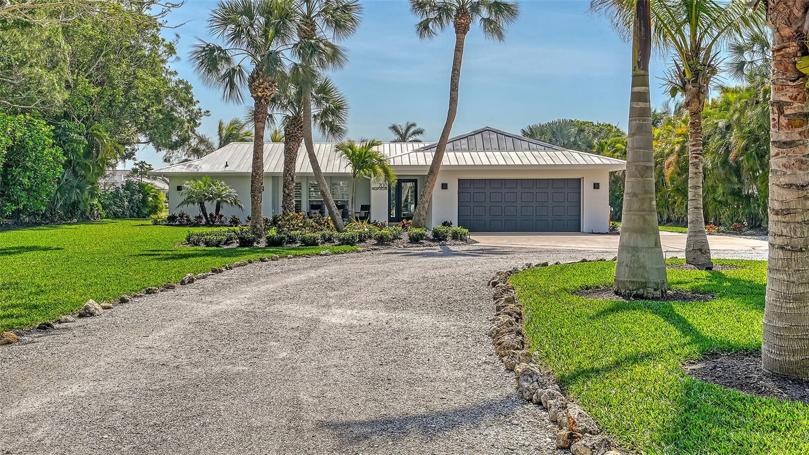 If life is but a dream, this tranquil waterfront retreat on Dream Island Road in coveted north Longboat Key, is a dream come true! Enjoy Longboat Key’s paradisiacal beauty on a 100 ft wide canal with your boat right at your backdoor. This half acre lushly landscaped property sits on a quiet and secluded street, Dream island Road has a wide canal and this home has a 500-ft private dock with a 16,000 pound boat lift. Explore the nearby Bay waters and the inter-coastal is accessible with no bridges. The interior of this 1755 Sq.Ft coastal cottage-style home has solid wood floors that flow seamlessly through the open floor plan offering casual island living. Light-filled and spacious, there’s plenty of room to live, work and entertain. Open the sliding doors to the saltwater pool and spa—and invite the outside in! The cool breezes and glistening waters are refreshing reminders why you chose this very special spot to call your own. This residence is a split plan and features two bedrooms, with a private master suite and ample master bath. The kitchen is a chef’s delight, featuring scrupulous craftsmanship and state-of-the-art appliances including a Viking stove and Sub-Zero refrigerator and Bosch dishwasher. Delight in outdoor entertaining on the spacious patio. This custom home has been completely redone to include new framing plus raised wood ceiling in the great room. The remodel includes all new electrical wiring, all new plumbing (supplies & drains) New Ac & duct work, whole house dehumidification system, Icynene insulation of interior walls, new drywall and custom wood trim throughout. Other features include all new cabinets / counter tops, window treatments and tint, hardwood flooring throughout, epoxy garage floors and garage cabinets. The newly renovated pool includes a hot tub and sun shelf. From every vantage-inside and outside-this lovely home offers a lifestyle that inspires tranquility. When you can pull yourself away whether by boat or car, you're only minutes from world-class dining and shopping, a host of cultural amenities and nearby barrier islands. Celebrate the natural beauty of Florida as it was truly meant to be experienced in this enchanting coastal home that is walking distance to the beach and the Gulf of Mexico.