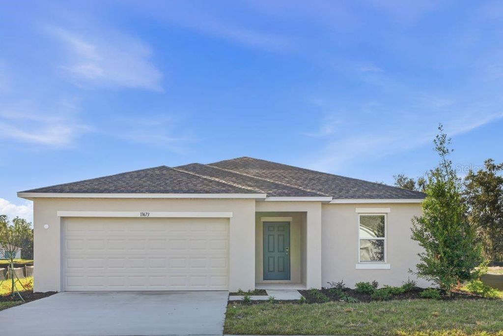 Photo of 13673 Tropical Breeze Way, Hudson, FL 34669 (MLS # TB8421517)
