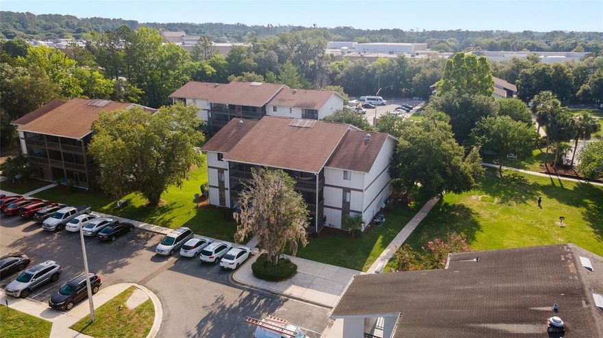 Beautifully updated 1-bedroom, 1-bath condominium featuring a spacious floor plan and an updated kitchen with breakfast bar overlooking the dining area. Enjoy a large living room that opens to a screened porch, perfect for relaxing or entertaining. The oversized primary bedroom offers two closets and plenty of space. Recent upgrades include stylish vinyl wood plank flooring throughout, fresh interior paint, and a new bathroom vanity and mirror. Ideally located just minutes from the University of Florida and Santa Fe College, and within walking distance to Oaks Mall, restaurants, North Florida Regional Medical Center, and convenient access to three bus routes. The community offers fantastic amenities, including a swimming pool, clubhouse, laundry facilities, and fitness center.