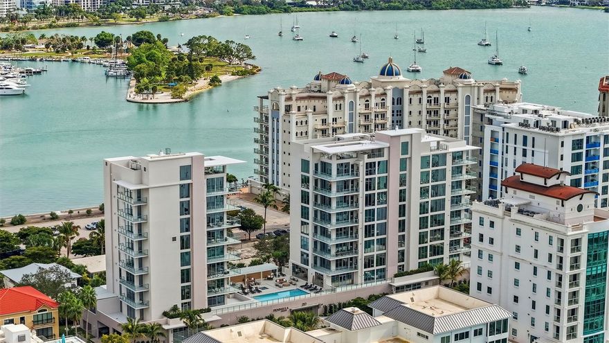 Newly completed, Peninsula Sarasota is ideally positioned in the coveted Golden Gate Point neighborhood, offering a peaceful residential retreat just moments from the vibrancy of downtown Sarasota. Designed by Blu Interiors, each residence showcases contemporary modern elegance with calming, sophisticated palettes, soaring ceilings, and expansive wraparound terraces that seamlessly blend indoor and outdoor living. Every element reflects a thoughtful commitment to refined luxury. State-of-the-art kitchens feature sleek European cabinetry, gas cooktops, and quartz countertops, complemented by premium Wolf and Sub-Zero appliances. Additional highlights include hardwood flooring throughout, floor-to-ceiling windows that flood the home with natural light, and a private terrace equipped with a gas grill—perfect for effortless entertaining. The spacious owner’s retreat serves as a true sanctuary, complete with generous walk-in closets, dual vanities, a soaking tub, and an oversized walk-in shower for spa-like relaxation. Residents enjoy on-site concierge services and secure, access-controlled underground parking for two vehicles, including an EV charging station. A private foyer and dedicated elevator provide direct access to exceptional amenities such as a resort-style pool and state-of-the-art fitness center, while the elegant owner’s club room offers private wine storage for each residence. The communal rooftop terrace sets the stage for unforgettable gatherings, boasting sweeping panoramic and sunset views. Peninsula Sarasota delivers a truly elevated lifestyle within a lush, tropical setting—just minutes from Sarasota’s celebrated arts, culture, dining, and award-winning beaches. A rare opportunity to experience sophisticated coastal living.
