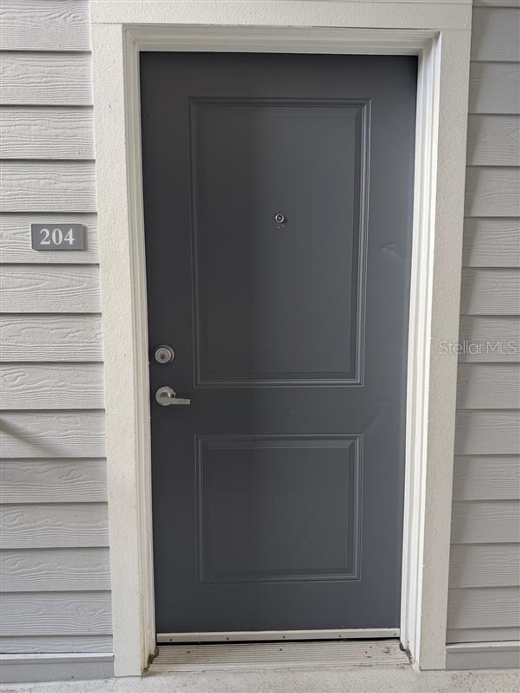 Photo of 541 Academy Drive #204, Kissimmee, FL 34744 (MLS # O6396542)