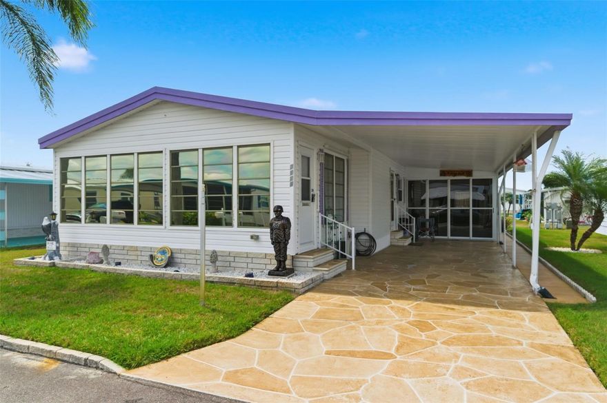 Welcome to your furnished double-wide manufactured home in the scenic gated senior community of Lake Conley in Holiday, Florida. Spanning approximately 1,960 sq ft. (total) this inviting residence was built in 1982 and offers a blend of comfort and practicality, perfect for a relaxed, quiet lifestyle. The home features two spacious bedrooms with walk-in closets, two full bathrooms, and a bright Florida room that adds extra living space. The cozy living room is ideal for gatherings, while the kitchen boasts newer oak cabinets with plenty of storage. Dining is centered between the kitchen and living room. It has a built-in storage hutch with glass cabinet doors. Additional highlights include a utility/workshop area, a shed for extra storage, a covered carport, and a lighted flagpole for exterior charm. Beautifully maintained lawn and home. Enjoy the friendly community with amenities such as a clubhouse, a heated pool, shuffleboard and horseshoe courts, a boat ramp, dock, and fishing pier. Optional boat and RV parking is available for a fee (subject to availability), and both golf carts and motorcycles are welcome. Lake Conley offers peaceful fishing, boating, and wildlife watching—embrace the Florida lifestyle every day! Standout features include land ownership, low park fees and a pet-friendly policy welcoming small dogs and cats (under 25 lbs.). Seasonal leasing is permitted for up to two months a year. Located in Pasco County near beautiful beaches, parks, and just an hour from the airport, this home is the perfect opportunity to enjoy all that Florida has to give!