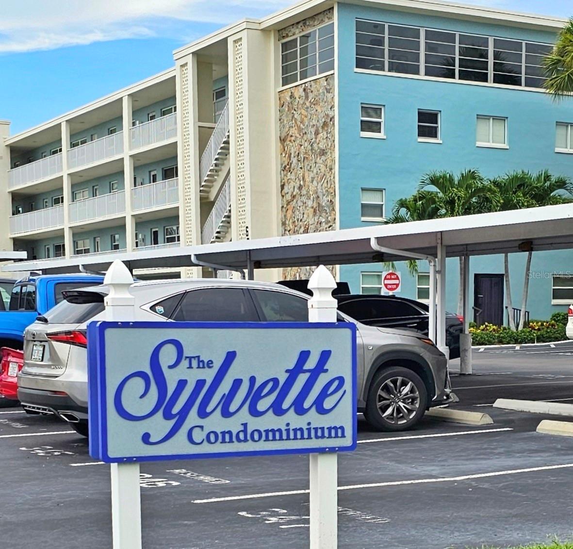 Welcome to this fully furnished condominium at The Sylvette, a highly desirable waterfront community in St. Pete Beach. This property offers convenient access to St. Pete Beach, shopping, and dining. Residents can enjoy a comprehensive suite of amenities, including two pools (one heated), a marina and fishing dock, BBQ stations, shuffleboard, on-site laundry facilities, meticulously maintained grounds, and a car wash station. This spacious unit features two bedrooms and two bathrooms, terrazzo floors, a large dining and living area, a fully updated kitchen with stainless steel appliances, a subway tile backsplash, butcher block counters, and a closet pantry. The living room offers views of one of the community pools through new windows. Additional features include a storage closet on the same floor, an assigned parking space, and convenient elevator access. The rent includes water, sewer, trash, cable, and internet. We invite you to experience the Florida beach lifestyle.