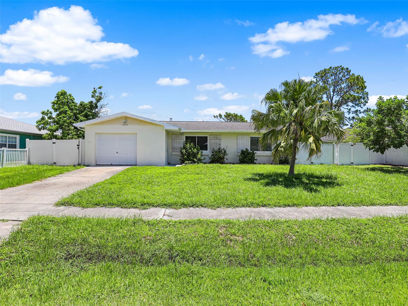 Welcome to your charming new retreat in the heart of North Port, Florida! This delightful 2-bedroom, 1.5-bathroom home with new hurricane windows offers a perfect blend of comfort, style, and functionality—ideal for year-round living or a seasonal escape. This property offers a peaceful setting with thoughtful upgrades and a welcoming interior that immediately makes you feel at home. As you step through the front door, you’re greeted by a bright and inviting living area with large windows that allow natural light to pour in, accentuating the neutral tones and modern finishes throughout. The open floor plan creates a seamless flow from the living space into the dining area and updated kitchen. Here, you'll find sleek white cabinetry, contemporary hardware, and eye-catching quartz countertops that provide both beauty and durability. Both bedrooms are comfortably sized and thoughtfully placed for privacy. The primary bedroom offers direct access to the updated half bath, while the main full bathroom features clean, modern finishes and a tub-shower combination. Laminate flooring throughout the home offers a cohesive look and low-maintenance convenience—perfect for Florida living. Step outside to discover a private backyard sanctuary surrounded by a fence, offering both security and peace of mind. The spacious yard has plenty of room for outdoor activities, pets, or even a future pool. Enjoy morning coffee or evening gatherings on the patio area, which is ideal for grilling, relaxing, or soaking in the Florida sunshine. The property also includes a separate indoor laundry/storage area. Additional upgrades include newer hurricane impact windows