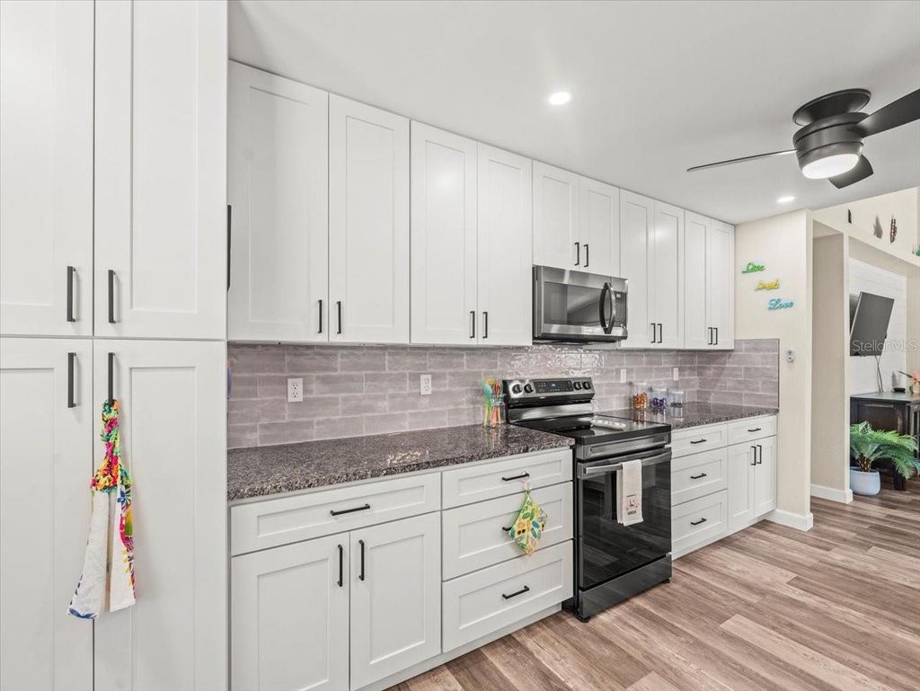 Photo of 1165 Falcon Drive, Dunedin, FL 34698 (MLS # TB8429189)