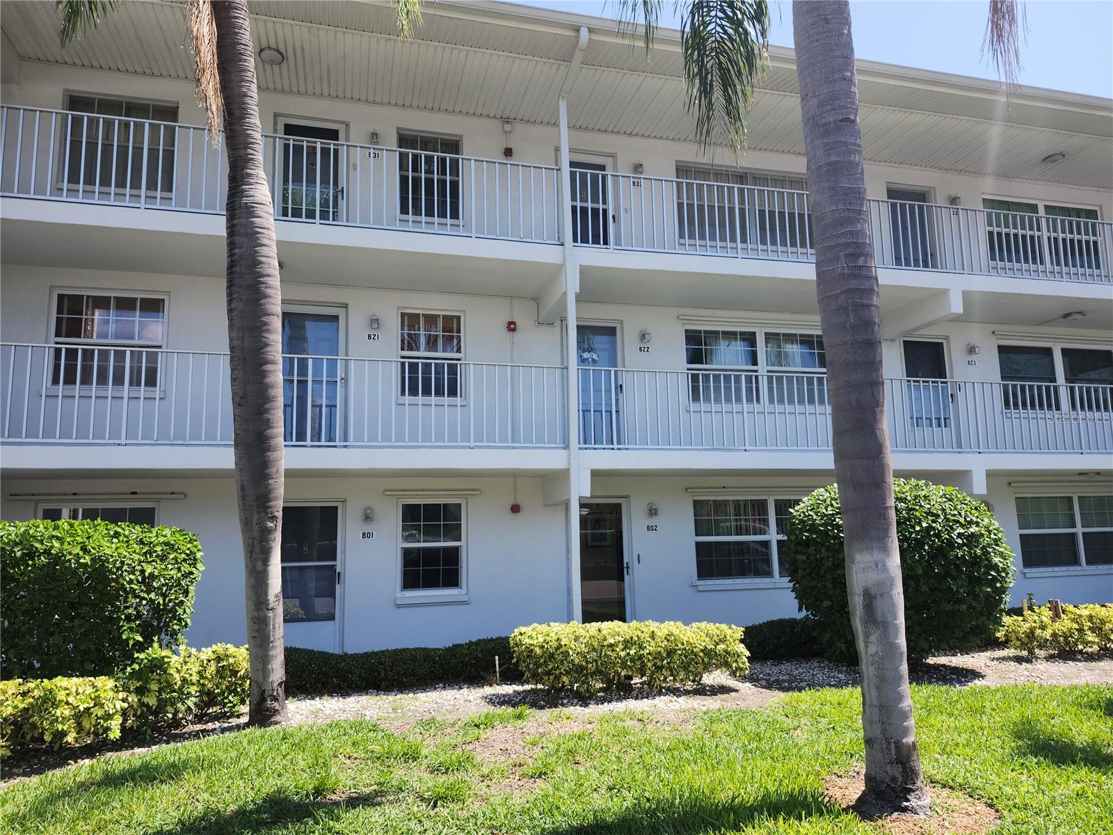 Updated 1-Bedroom Ground Floor Condo with Pond Views and Covered Carport! This move-in ready unit offers a great blend of comfort and style with numerous updates throughout. The kitchen features updated cabinetry & countertops, and a convenient stackable washer/dryer tucked at the end of the counters. You'll love the warmth of the Brazilian hardwood floors in the living and dining areas, while the bathroom has been refreshed with a modern vanity. Enjoy natural light and relaxing pond views from the cozy breakfast nook and spacious bedroom. Additional highlights include newer windows and removable hurricane shutters for added security and efficiency. Bay East offers fantastic amenities including a large pool with covered lanai area, shuffleboard courts, and a clubhouse with kitchen, billiards, and a TV lounge—perfect for relaxing or entertaining. All of this in a prime location just steps from Winn Dixie and minutes from beaches, shopping, and restaurants. A great opportunity for easy, low-maintenance living!