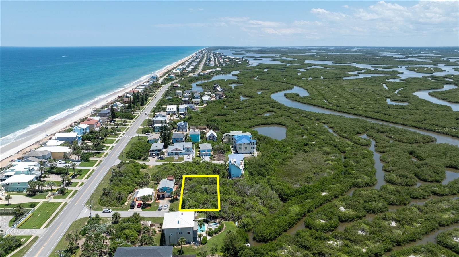 Build your coastal retreat dream on this rare and spacious 75' x 100' beachside lot located just 400 feet from the beach walkover. Enjoy the pristine, car-free sands of Bethune Beach in beautiful New Smyrna Beach. Nestled in one of the island's most coveted communities surrounded by multi-million dollar residences, this property offers dramatic views of the estuary from the second and third stories, with possible ocean views as well. Enjoy the sights and sounds of nature, from birds and dolphins to manatees and more. Just minutes from shopping, dining, and less than 10 minutes to vibrant Flagler Avenue, with easy access to multiple boat ramps, scenic parks, and bike trails. One of the last remaining buildable lots on the island, this is a truly rare opportunity to craft a luxury lifestyle where the river meets the sea. ALL INFORMATION IS ASSUMED ACCURATE BUT NOT GUARANTEED. ALL MEASUREMENTS ARE APPROXIMATE. BUYERS AND THEIR AGENTS SHALL VERIFY ANY INFORMATION DEEMED IMPORTANT TO THEM.