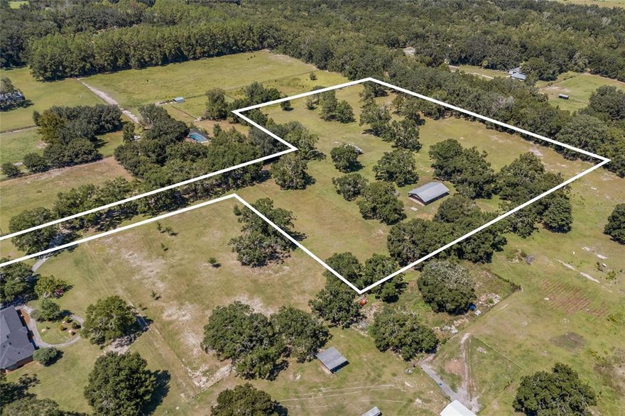 Tucked away in a highly desirable area off a paved road, this 9.78-acre property offers a perfect blend of privacy, natural beauty, and convenience. A picturesque drive-in welcomes you with towering oak trees and a peaceful setting—ideal for those seeking a quiet retreat, a working farm, or the perfect homesite. This property is already equipped with a well and power, providing a strong foundation for your plans. Two spacious barns offer endless possibilities for storage, livestock, or future projects. With no HOA or deed restrictions, you have the freedom to build, expand, or create your dream escape without limitations. Located just minutes from Gainesville, High Springs, and Alachua, this property provides easy access to top colleges, hospitals, and city conveniences while maintaining a serene, country feel. Outdoor enthusiasts will appreciate the proximity to state parks, the Suwannee and Santa Fe Rivers, and stunning natural springs—perfect for kayaking, hiking, and weekend adventures. Opportunities like this are rare—don’t miss your chance to own this exceptional piece of North Florida!