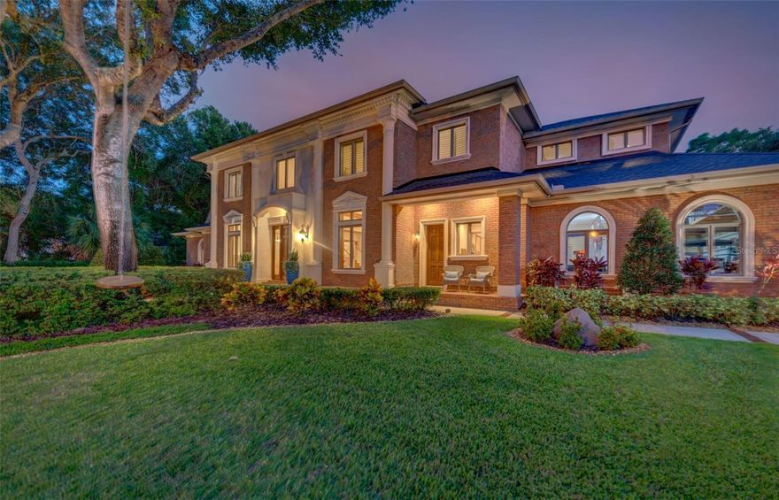 A truly masterful achievement of concept and design, this stunning custom built 5,930 sqft residence showcases exquisite craftsmanship, classic elegance & cutting edge design. Meticulously maintained and landscaped this 25,552 sqft lot is located in one of Clearwater's premier gated communities Woodsong. Step into Timeless Elegance: soaring ceilings, 5" baseboards, crown molding, 24" x24" ceramic tile and hardwood floors. The reading room offers peaceful solace from any busy day. Functional family room: beamed coffered ceiling, built-in entertainment center, lit artist niches, gas fireplace, plantation shutters. The dinette is perfectly positioned for any family. Butler's pantry: Sub-Zero wine refrigerator, sink, granite top, tile back splash, cabinet storage with glass fronts, leaded glass doors open onto the extensive paver pool patio. Culinary kitchen: island with vegetable prep sink, low bar perfect for snacks & cabinet storage, 2x Wolf ovens, 6-burner gas cooktop, range hood, granite tops, tile backsplash, maple stained wood cabinets, desk. The adjacent dining room will seat any large family - chandelier & chair rail. Back sunroom overlooks the lushly professionally landscaped back yard: built-in desk shelving & tile floors. 1st floor sumptuous master bedroom: crown molding, hardwood floors, his & hers separate walk-in closets! Master bathroom: travertine marble floors, 2x sink, granite top, wood cabinets, soaking tub, glass walk-in shower, make-up vanity, separate water closet. Ideal In home office: hardwood floors, large closet storage & fan. Pool Bath: walk-in shower, granite top vanity. Custom powder room. Laundry room opens onto the covered front porch!: laundry chute, cabinet storage & utility sink. Second floor game &/or media room perfect for a private retreat: closet storage, wet bar with wine cooler & back staircase. Second floor four large bedrooms, finished closets, fans, hardwood floors & bathrooms en-suite. The fifth bedroom is currently used as a crafts room has back balcony access glass French doors. The outdoor area is an entertainers delight brick pavers, bead board ceiling, salt water pool & electric heated spa, gas grill, granite top, Lynx stainless gas grill, stainless sink. Outdoor shower! Side-load 3-car garage, sports court driveway basketball anyone? 20KW Generac guardian series generator. Roof 2020, A/C 2021 & 2023. Sprinkler on well.