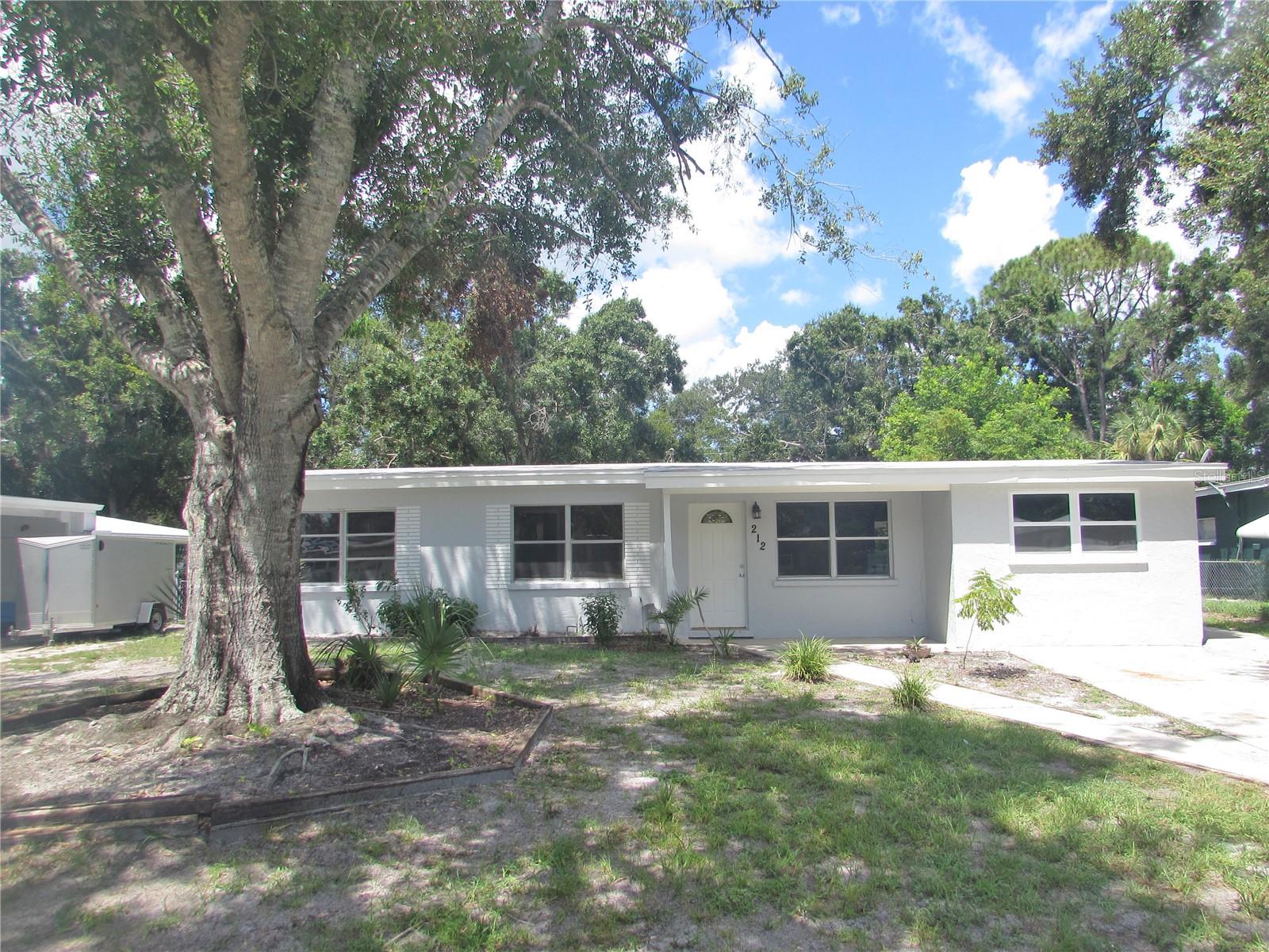 This affordable, solid concrete block home has had recent improvements and is ready for a new owner in Eastwood! Featuring 3 bedrooms, 1 bathroom, and 1223 sq ft of living space, a laundry closet, and a large, screened lanai. The property also has an oversized shed with electric and there is no HOA and no deed restrictions. The roof was done in 2018 and the electrical panel was upgraded in 2018. The entire interior and exterior have a fresh coat of paint, and the flooring has been redone with LVP in 2025. The kitchen has granite counters and wood cabinets. The backyard is fenced and has a paved walkway to the shed. The X factor here is the large shed which has the potential to become an office, hobby room, or whatever you want it to be. There is a lot of value in this floor plan for the right buyer. This home is located in a convenient area, with easy access to Fruitville Rd, Downtown Sarasota, I-75 and all area amenities. Perfect for first time buyers, part time residents, and investors. Easy to show!