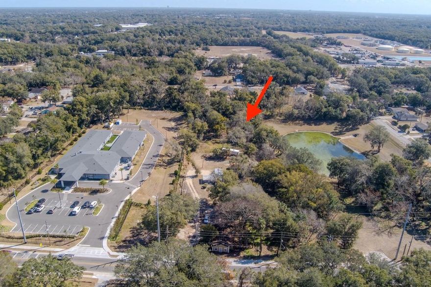 Buildable 0.40 acre parcel in heart of Apopka. Back yard overlooks a pond. Land is zoned R-3, currently allows one single family residence. No HOA. A small portion of property (SW corner nearest pond) is flood zone A. Property is NOT wetlands. 2 brand new construction homes just built and sold directly east. Zoning code R-3, one single family home can be built. Resides within Orange County for development standards. BUYER MUST DUE THEIR OWN DUE DILIGENCE TO CONFIRM THE FOLLOWING ITEMS: There is an open right of way to property that is not currently maintained. The new property owner will have to build a paved entrance to Orange County standards to the property and then the county will maintain road after that. Call County zoning, planning & development office for possibility of changing zoning to subdivide into 2 parcels. Call County for details on connecting utilities.