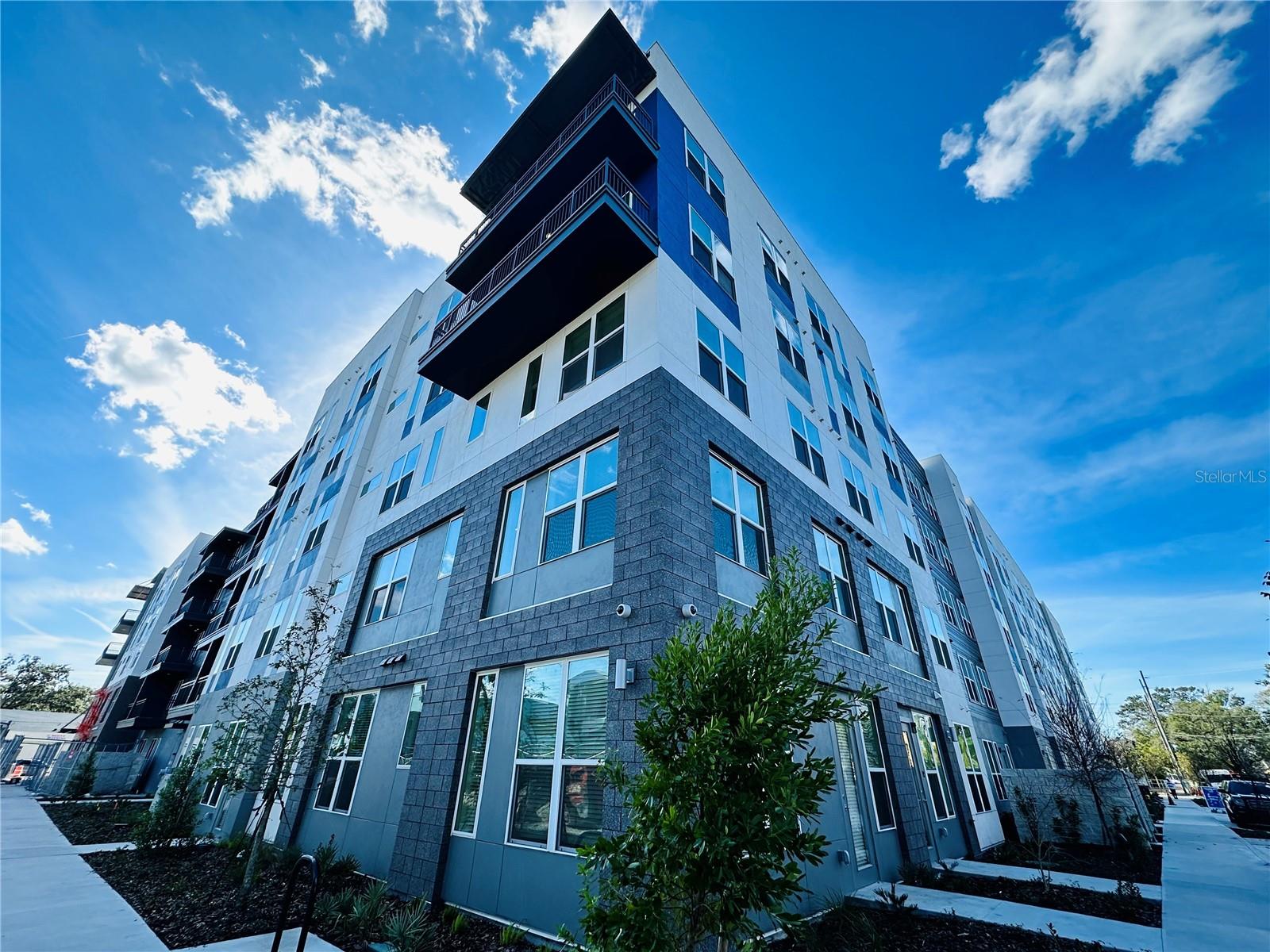 BRAND NEW COMMUNITY IN THE HEART OF ORLANDO
An urban oasis where modern living meets boundless creativity! The fusion of contemporary design and functional amenities paints a vivid picture. Imagine waking up in one of those sleek studios, one-, or two-bedroom apartments, greeted by stylish interiors that blend comfort and sophistication seamlessly.
Picture yourself in the kitchen, a haven for culinary adventures, boasting a chef-inspired layout with quartz countertops, stainless-steel appliances that gleam against the backsplash, and upgraded cabinetry offering both elegance and practicality. The gooseneck pull-down faucet in the single-basin sink adds a touch of modernity, while the under-cabinet lighting sets the stage for culinary mastery.
As you step into the living space, envision the ambience created by the dimmable fixtures casting a soft glow, perfect for relaxing evenings or vibrant gatherings. The wood-inspired luxury plank flooring adds warmth and charm, guiding you toward the patio or balcony where you can take in the vibrant atmosphere of Orlando's Mills 50 District.
But it's not just about the living quarters! The Co-Create studio beckons with its promise of transforming artistic visions into tangible reality. Whether it's painting, sculpting, or crafting, this space encourages your creative spirit to flourish. And the Co-Work Lounge serves as a hub for productivity and collaboration, fostering the growth of innovative ideas and entrepreneurial ventures. The Clubroom, alive with games and camaraderie, invites social interaction and community bonding, creating a vibrant atmosphere where residents can connect and unwind. And let's not forget the resort-style pool—an oasis of relaxation and rejuvenation amid the hustle and bustle.
These apartments aren't just spaces; they're canvases waiting for personal touches. With tech-rich features like smartphone keyless entry and Nest thermostats, paired with high-speed internet, Alexan Mills 50 isn't just a place to live—it's a canvas where your unique lifestyle and creativity can flourish.