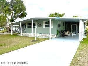 Photo of 7391 Harlow Street, Brooksville, FL 34613 (MLS # W7887875)