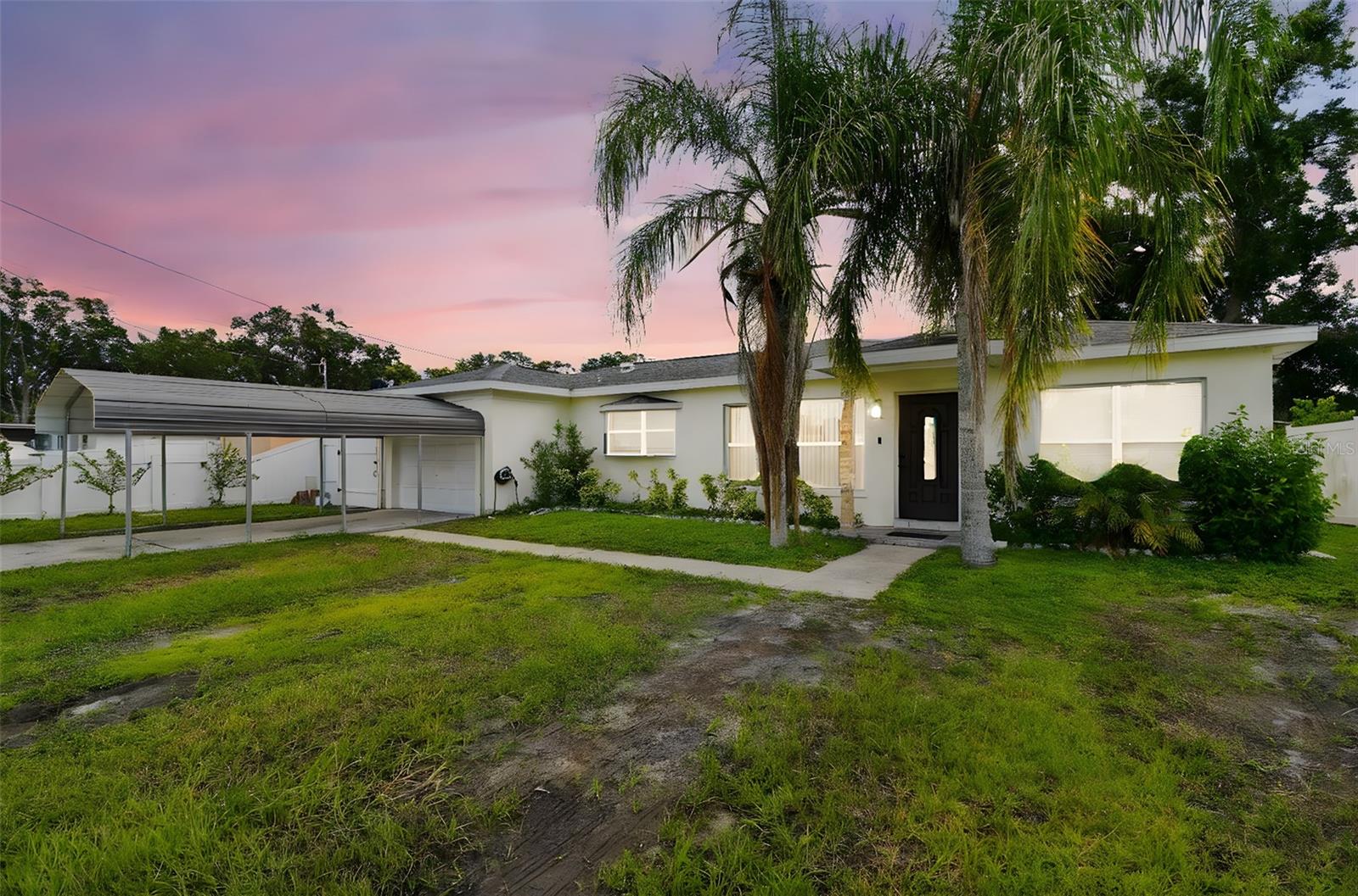 This beautifully upgraded block-construction home is located in the heart of Tampa and offers four spacious bedrooms. A separate APARTMENT features its own kitchenette—perfect for guests or as a source of rental income. The property boasts a ROOF installed in 2020, a newer AC system, and a FULLY FENCED yard with vinyl fencing. Inside, you'll find a chef's dream kitchen with solid wood cabinets, stunning quartz countertops, and easy-to-maintain tile flooring. The bathroom has been FULLY UPDATED, and the yard is accessible and ideal for entertaining, complete with an outdoor kitchen. This home offers an unmatched lifestyle opportunity, conveniently located just minutes from Raymond James Stadium, top restaurants, International Plaza, and major shopping centers. NO FLOOD NO FLOOD ZONE.