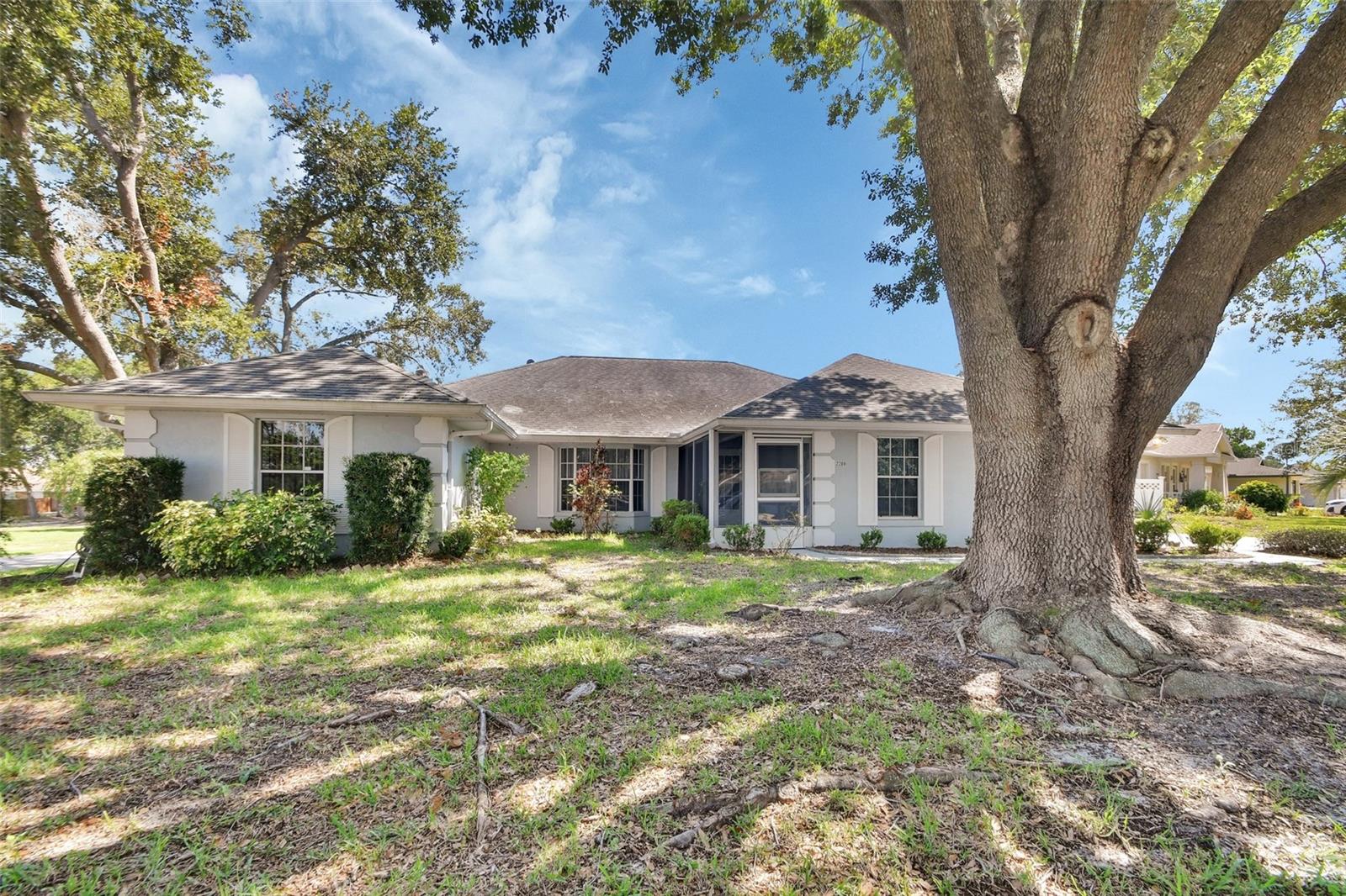 Beautiful Spacious 3 Bedroom, 2 Bath Home Nestled on a High Dry Corner Lot in a Quiet, Peaceful Area of Lovely Homes with No HOA.
Living Room, Dining Room, Kitchen Opens to Large Family Room With Beautiful Fireplace and Built In Shelving, Dinette, Split Bedrooms, Multiple French Doors Lead to a Huge 27' X 11" Air Conditioned Florida Room, The Primary Bedroom Has a Walk In Closet With Built In Shelving. Two Car Garage Has Extra Cupboards for Storage and a Sliding Screen Door for those who Like To Work In the Garage. There is a Storage Shed. Newer Dishwasher, Disposal, Water Heater and Air Conditioning. The Seller Will Replace The Roof At Full Price!
There is a View of a Lake Across The Street. All Information Deemed Correct but not Guaranteed. Buyer and Buyers Agent to Verify. The Home may Be Under Audio/Video Surveillance. Sold As-Is. Call Today to Preview This Beautiful Home!