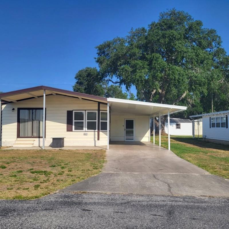 This is a nice little unit located in Betmar Acres,. There is a very large sunroom addition along with another very large man cave with hurricane door for cart. It is a 2b2b furnished unit. It comes fully furnished with appliances and washer dryer. There are tons of amenities in the park and so many clubs to be involved in.