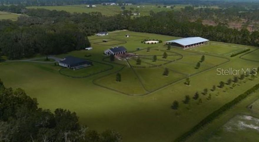 Includes 7851 NW 162nd Court & 7990 NW 16th Avenue
Property has Generator, Propane Tank buried for gas, 2 wells, 3 septics

Barn - 5 stall, Tack room, Office Area, Hay Room (with garage door), Feed Room, Shavings room (with garage door)
Wash Area (2)

Arena 200x100 Covered

Guest Home 7990 Address 
2021 Year Built
3/2
1471 square feet living

Two gated entrances one off 160th and second off 162nd
Two separate electric meters for the two homes