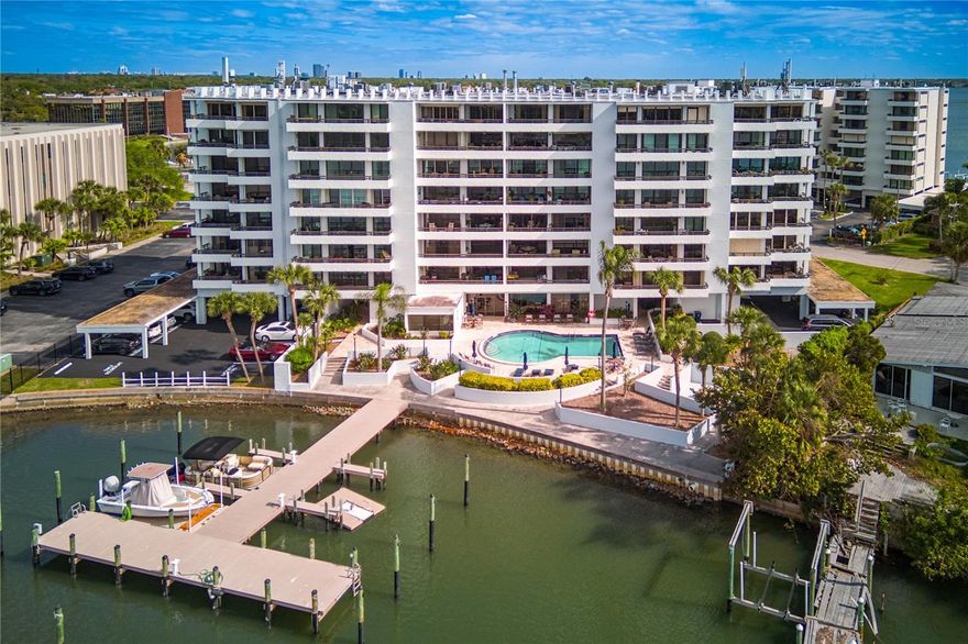 Enjoy sweeping Tampa Bay views and Florida sunsets from this Northwestern-facing condo in South Tampa. This 1 bedroom, 1.5 bathroom 5th floor unit has expansive water views from every room and a spacious balcony with plenty of room for seating. The entire unit has been tastefully updated with wood-look tile flooring and serene coastal paint colors and has plenty of storage. The kitchen has stone counters, shaker cabinets and a cherry island with counter seating. The living room has wall-to-wall sliders opening up to the balcony.  The primary bedroom suite also has balcony access as well as a full bathroom with dual sinks, a separate vanity, a remodeled shower and a walk-in closet. A half bathroom and laundry are also in the unit. Brand new A/C unit and sold fully furnished. A separate storage unit is also included. Mariner’s community amenities include a community pool, fitness center, clubhouse and boat slips which can be rented as well as ample guest parking. Conveniently located near South Tampa’s Westshore District near shopping, highways and Tampa International Airport, as well as in the Plant School District.
