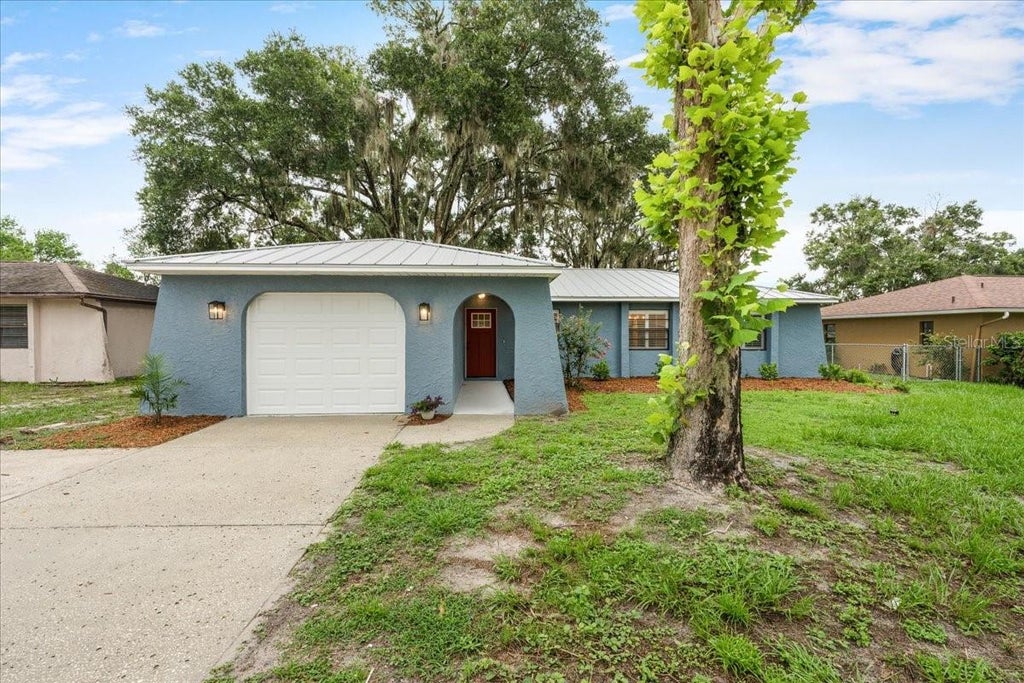 Photo of 12830 Lake Tree Lane, Hudson, FL 34669 (MLS # TB8535046)