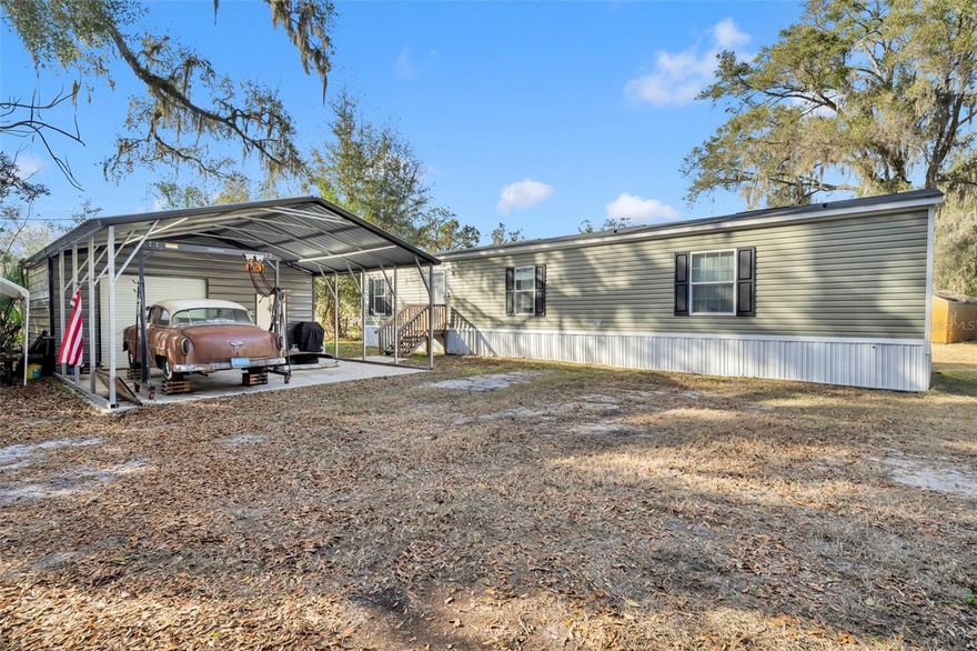 Welcome to easy Florida living in the heart of Bushnell! Built in 2021, this beautifully maintained 2-bedroom, 2-bath mobile home offers modern comfort with the charm of small-town living — all just minutes from the historic Dade Battlefield Historic State Park and downtown Bushnell.
Step inside to an open and inviting floor plan featuring a bright living area, a spacious kitchen with ample cabinetry and counter space, and a split-bedroom layout that provides privacy for both owners and guests. The primary suite includes a generous bedroom, walk-in closet, and updated shower, while the second bedroom and full bath are perfect for visitors, family, or a home office.
Outside is where this property truly shines. Situated on a large, fully fenced lot, there’s plenty of room for pets, gardening, outdoor entertaining, or simply enjoying peaceful Florida evenings. The detached shop adds incredible value — ideal for hobbies, storage or a workshop. Recent upgrades include, brand new drain field. (2025) Newer well. (2023)
Whether you’re looking for a primary residence, a winter retreat, or a low-maintenance investment property, this home delivers newer construction, outdoor space, and a prime location close to parks, recreation, and downtown Bushnell conveniences. Affordable. Move-in ready. And full of possibilities