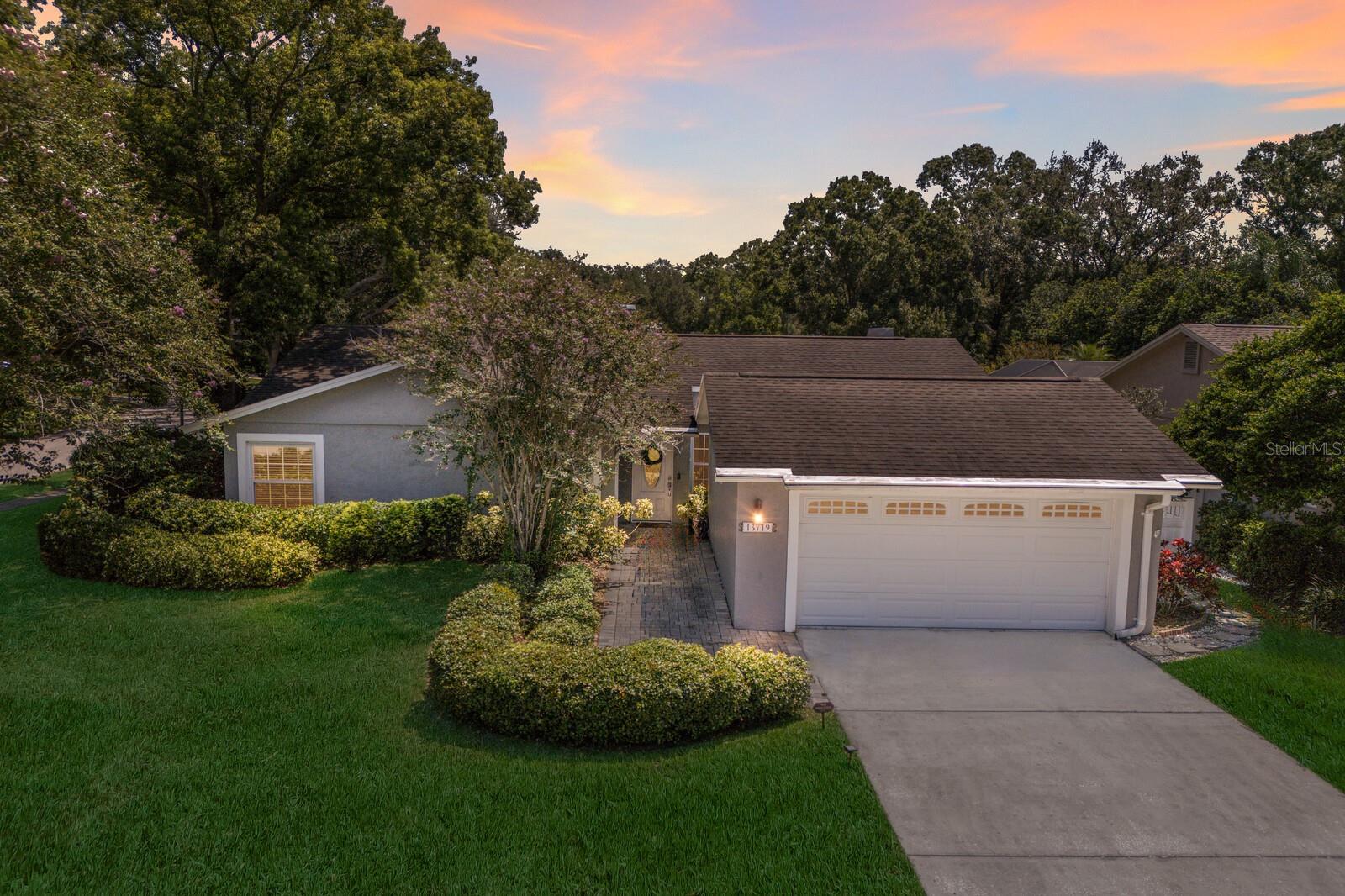 WELCOME to this BEAUTIFUL 3 bedroom, 2 bath, 2 car garage POOL home in the sought after community of Tarawood in the heart of Carrollwood!!! This one story home offers 1,872 sq. ft. of comfortable living space and sits on a desirable CORNER LOT providing extra room and PRIVACY. As you enter, you’re greeted by a spacious living room and dining room filled with natural light and VAULTED ceilings, with the living room featuring a wood-burning FIREPLACE perfect for cozy evenings and the dining area overlooking the pool for casual or formal meals. The fully UPDATED kitchen opens to the family room and is ideal for entertaining, boasting granite countertops, stainless steel appliances, a STYLISH tiled backsplash, and an extended island with seating for everyday dining. The primary suite is a true retreat with sliding doors that lead to the patio, a walk-in closet, and an ENSUITE BATH complete with a glass enclosed tiled shower with built-in bench. Two additional bedrooms share a full bath with a tub, offering comfort for family or guests. Step outside to your private Florida oasis with a screened lanai featuring a covered sitting area and SALTWATER POOL, perfect for year round fun and entertaining, while double French doors from both the living and family rooms create a seamless flow between indoor and outdoor living. The FENCED backyard provides an open grassy area ideal for pets, gardening, or relaxing in the sun. Additional highlights include LUXURY VINYL FLOORING throughout, a NEW AC unit, WHOLE HOUSE WATER FILTRATION SYSTEM with WATER SOFTENER, HURRICANE RATED WINDOWS, an alarm system on all doors and windows, and LUSH mature landscaping. Tarawood is a hidden gem of an established community known for its beautiful OAK TREE lined streets and UNIQUE homes, conveniently located near USF, downtown Tampa, Ybor City, Tampa International Airport, shopping, restaurants, schools, and major highways, making this home the perfect blend of comfort, style, and location. Don't wait and start living your Florida LIFESTYLE today!!