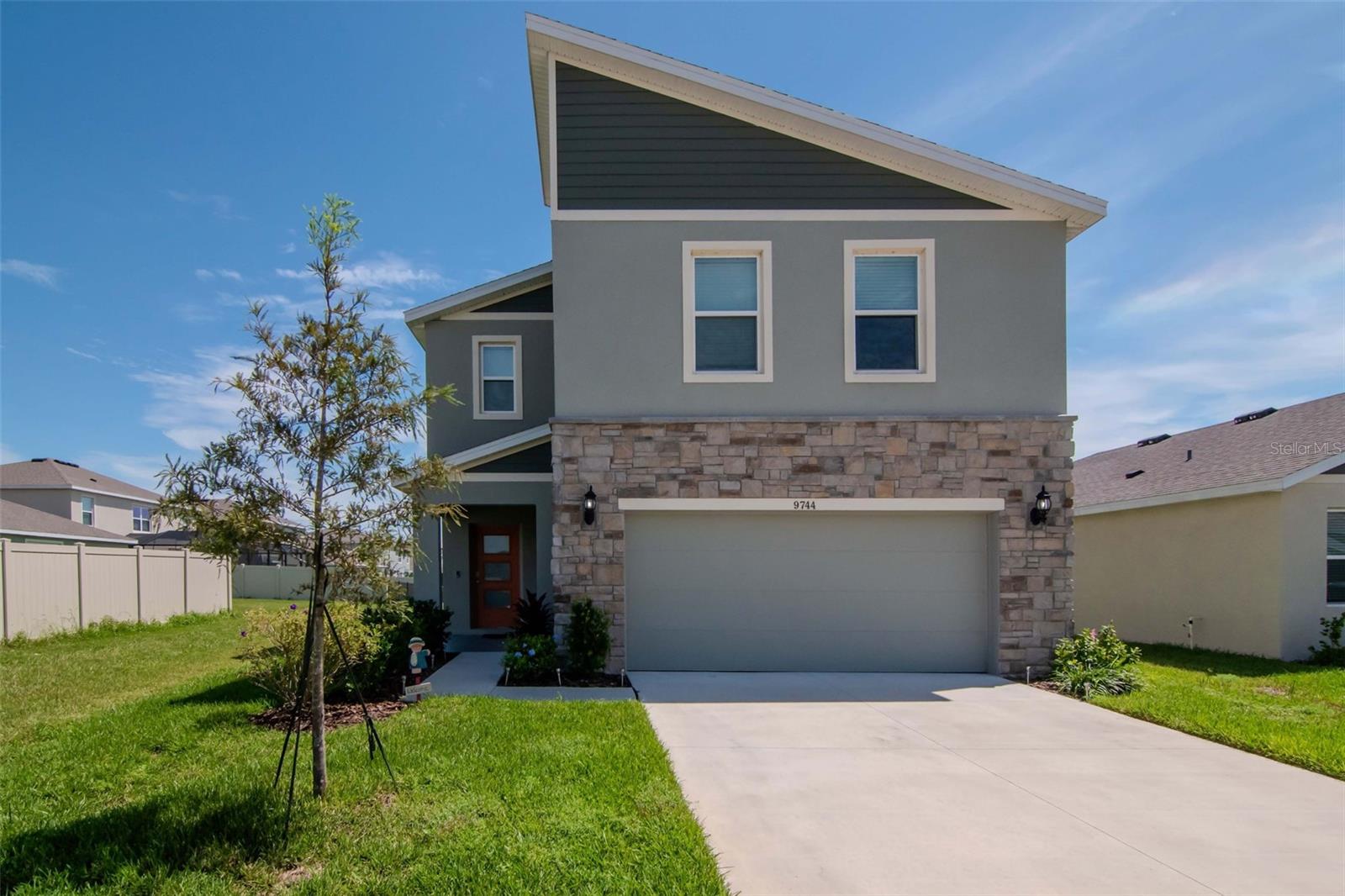 Welcome to Epperson and the Epperson Lagoon lifestyle. This 4 bedroom 2 1/2 bath home has an open floor plan and is situated on one of the few community's ponds with grassed easements to the left and back of the property. The front foyer leads to a bright and sunny living area open to the kitchen and dining areas. In the kitchen modern shaker cabinets with white solid surface counters are accented by stainless steel appliances and tiled backsplash. The large island has bar seating for four while the dining area can host 6 to 8 people easily. From there, sliding glass doors lead to an outside 18 X 24 caged screened in lanai. This outdoor room overlooks the pond and has a dining and entertaining area. This is over 400 square feet of extra outside enjoyment! The second floor is anchored by an open loft area at the top of the stairs, perfect as a den or play area. The primary bedroom with en-suite bathroom has a walk-in closet. There are 3 additional bedrooms, second full bath and laundry room on this level. A part of the Epperson lifestyle is of course Epperson Lagoon, a 7.5 acre resort style man made lagoon with beaches, water activities and dining options. The community also has play grounds and natural trails throughout. Located in the fast growing area of Wesley Chapel, Epperson is close to many shopping and mall options, with easy access to I-75, I-275 and Tampa International Airport. Make an appointment to see your future home in this great community.