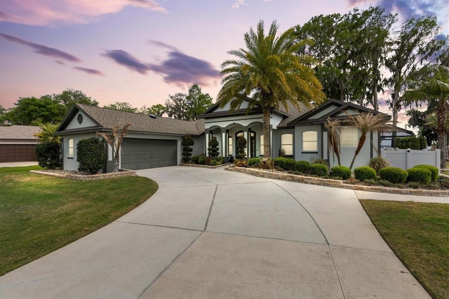 4/3 in Eagle Point in Leesburg. Direct Harris Chain of Lakes access with dock, covered boat house and lift. Renovations from 2023-2026.

Waterfront home in Eagle Point in Leesburg, Florida with direct Harris Chain of Lakes access. This 4-bedroom, 3-bathroom home features granite kitchen counters overlooking the water, porcelain tile flooring throughout, and vaulted ceilings with wall of windows framing panoramic lake views. The primary suite opens to the water via oversized sliding doors, with a tiled bathroom featuring rainheads and tankless water heater (2023) providing instant hot water. Living areas include a family room with new 3-panel picture window (2026), game room with 3-panel pocketing slider, and multiple accordion-style openings to outdoor spaces.

Major systems recently updated include new roof (2023), HVAC (2020), and hot water heater (2023). Energy efficiency features include automatic solar attic fans, four tubular skylights, and new flush-mount LED lighting throughout (2026). The home also features a new sprinkler system and wide-view screen enclosure.

The 0.36-acre lot includes a refreshed saltwater pool with new salt cell (2026), resurfaced interior, updated plumbing, and remote LED lighting. A sun shelf provides in-water relaxation while taking in sunrise and sunset views. The new travertine deck spans the full width of the home and features electric roll-down screens for year-round outdoor living. A composite dock with 5,000-pound capacity lift accommodates boats up to 25 feet, with water and electric connections. New paver walkways connect the dock to the front entrance. The oversized 21' x 36' garage provides ample vehicle and storage space.

Harris Chain of Lakes access allows boating to waterfront restaurants and nearby towns. The property is not in a flood zone. HOA is $170 annually with minimal restrictions. Start enjoying the Lake Life Today.