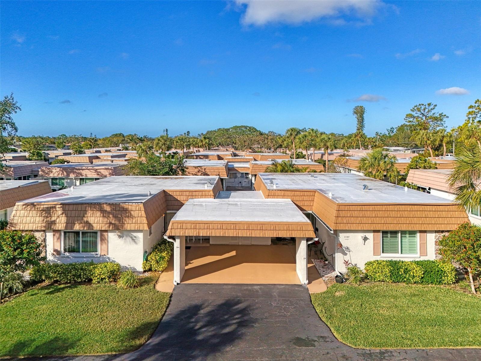This immaculate, well-maintained villa is minutes to everything you want to enjoy in a Florida resort style community. This is a 55+ neighborhood, minutes to Siesta Key with a marina and first come first-served boat docks. Annual fee for a boat dock is $1344. Bring your kayak for easy access to Phillippi Creek, the Intracoastal and the Gulf. Worry free lifestyle as this villa is turnkey furnished, has a newly replaced roof and gutters (2024), new water heater (2 months old), AC is 4 years old and no carpets. Updated windows except small frosted windows in bathrooms. There is a whole house surge protector. Enjoy the open floor plan with plenty of room to entertain family and friends. Your comfortably sized kitchen has granite countertops. Both bathrooms have granite countertops. Guest quarters have privacy with an en-suite 2nd bath. Primary bedroom has an en-suite bath as well as a walk in closet. All appliances working but $1,000 credit for updating. Keep yourself young and vital while enjoying the Florida sunshine and many planned activities at the clubhouse. Strathmore Riverside is on the water within minutes to Siesta, great dining options, doctors, hospitals and the many cultural venues downtown Sarasota has to share.