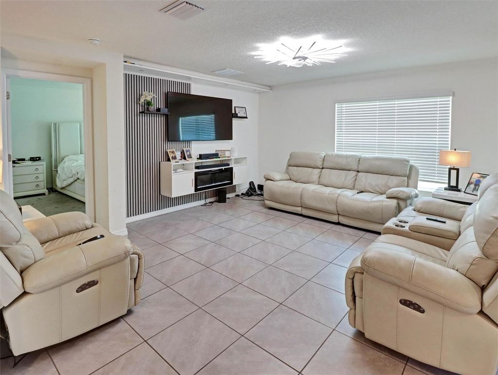 Photo of 1202 Tahitian Sunrise Drive, Plant City, FL 33565 (MLS # TB8501210)