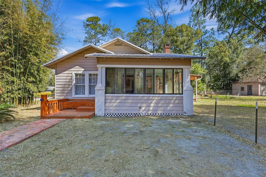 Live just a five-minute walk from downtown High Springs in this fully renovated historic home set on a rare 0.34-acre corner lot. Offering 1,585 square feet of flexible living space, the home combines restored original wood floors and authentic 1930s character with thoughtful modern updates. The layout includes a spacious living room, formal dining room, bright sunroom, private office, two bedrooms, and 1.5 baths. The fully renovated main bathroom features updated tile and modern fixtures, along with a whole-house electric tankless water
heater for on-demand hot water. The kitchen is a standout, showcasing solid hard maple cabinetry with dovetail joinery and soft-close drawers, granite countertops, matching stainless steel Whirlpool appliances, custom glass accents, and a handcrafted live-edge wood bar top that adds warmth and architectural presence. The fenced backyard includes a dedicated garden area, mature clumping bamboo for
natural privacy, and multiple decks designed for outdoor living. A detached garage provides additional storage or workshop space.
Enjoy a country feel with the convenience of being just 25 minutes from Gainesville. Natural springs, rivers, and state parks are minutes away. Cedar Key is about an hour away, and Orlando, Jacksonville, St. Augustine, and Florida beaches are all within
approximately two hours. Located within the City of High Springs with municipal services and high-speed fiber
internet available.
So much Charm! Don't miss this great home!