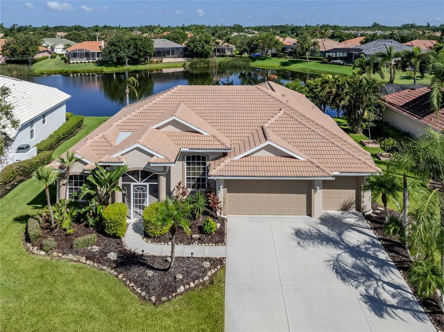 PRICE IMPROVEMENT....NOW LISTED AT $699,000 — Discover your dream home in the Laurel Lakes Association! This spacious and impeccably maintained 4-bedroom, 3-bathroom home with a den offers an unparalleled living experience. You'll be captivated by the beautiful lake view from almost every room, providing a serene backdrop while maintaining your privacy. The kitchen view is truly a showstopper!

Step inside and appreciate tile and wood flooring throughout, with only the generously sized bedrooms featuring fresh, clean carpeting. You'll rest easy knowing that major updates have been taken care of, including a NEW TILE ROOF in 2024, a RESURFACED POOL and NEW AIR CONDITIONER in 2023, and a new pool heater in 2017. Plus, mounted hurricane shutters ensure easy and quick closure for peace of mind. The three car garage offers generous capacity for both cars and additional storage.

Living in Laurel Lakes means enjoying an abundance of amenities. The community boasts a pool, a clubhouse (currently undergoing exciting refurbishments!), tennis courts, pickleball courts, and a basketball court. It's a gated community with irrigation included, all for a low annual HOA fee with NO CDD (Community Development District) fees.

You’ll find both The Classical Academy and Tatum Ridge Elementary School nearby. Parks and grocery stores are also within easy reach.

Don't miss this incredible opportunity to see this wonderful home and experience the best of Florida living!