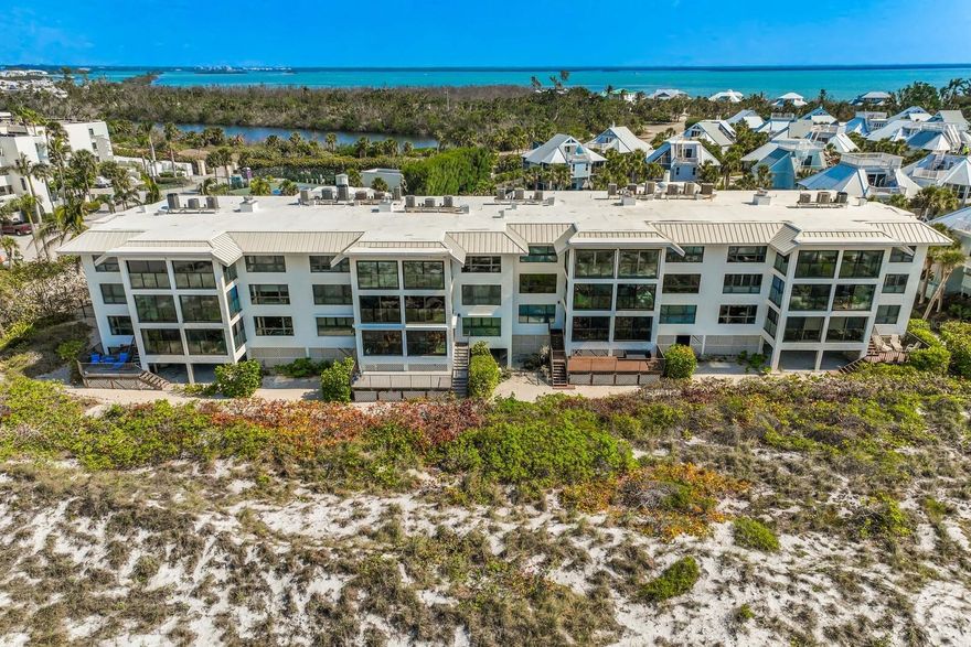 Welcome to your walk-out beachfront paradise! This spectacular 3 bedroom and 3 bathroom Boca Grande Club Beach Manor has been attractively updated and enjoys boundless views and direct access to the most desirable stretch of beach on Gasparilla Island. The remodeled living space allows for instant, and striking views of the Gulf of Mexico as you step inside the front door. The kitchen, master bedroom and master bathroom were updated in 2018 by McHugh-Porter Builders who also installed Preverco engineered hardwood flooring in all main living areas. New impact glass was installed summer 2022, combined with brand new electric roll down shutters in spring 2023. Enjoy evening sunsets and gulf breezes on the gulf side indoor/outdoor porch or laze under the sun and read a book on the additional private outdoor sundeck on the west side of the unit. Boca Grande Club is a gated community just minutes from the Village of Boca Grande and offers numerous amenities, including newly renovated club house with gulf front dining, pool side dining, a tiki bar for sunset cocktails, 8 Har-Tru tennis courts and a robust tennis program and pro shop, recently renovated fitness center, beach chair, towel service and more.
