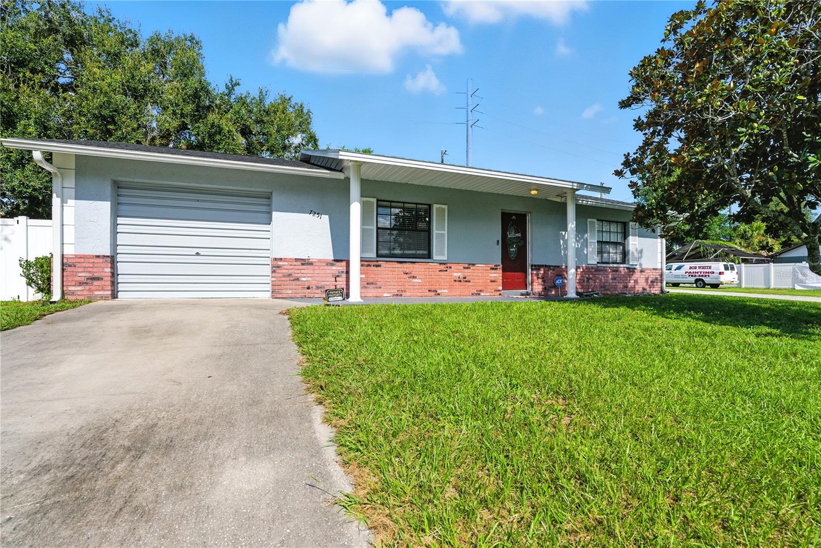 Discover the possibilities at 7251 Applegate Dr in Zephyrhills! situated on a spacious corner lot, this 2-bedroom home includes an additional living flex space from a thoughtfully converted garage with ducted central A/C—ideal for a home office, guest room, gym, or even a 3rd bedroom. Major updates bring peace of mind with a newer roof, A/C, water heater, pool pump, and updated electrical, with transferable warranties. The backyard is fully fenced with a new privacy vinyl fence, while the enclosed porch and screened-in pool are ideal for relaxing or entertaining; the perfect setup for year-round Florida living. No HOA or CDD fees here. Alpha Village is a charming community less than 1 mile from the hospital, shopping centers, restaurants, and entertainment venues. Whether you’re looking for a a low-maintenance retreat, a great starter home, or an investment property, this home is PRICED TO SELL!! and offers endless opportunities!