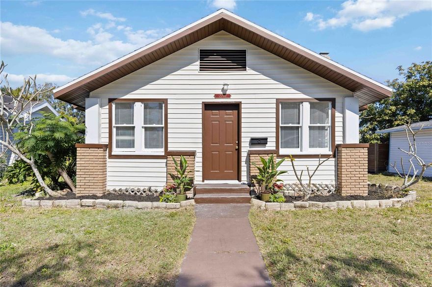 Nestled in the heart of Bradenton’s coveted River District, this beautifully renovated cottage-style vintage home has been thoughtfully brought back to life, blending timeless character with refined modern updates. The charm of the original residence remains evident in the meticulously restored hardwood floors, which continue seamlessly throughout the home. Major improvements include a new roof, updated plumbing, new fence, and a new water heater, providing peace of mind while preserving the home’s historic appeal.

A welcoming entry opens to a charming front room, offering flexible use as a sitting area, home office, or creative space. The living room is anchored by the original brick fireplace, a warm and authentic focal point that speaks to the home’s heritage. The updated kitchen and bathrooms are both stylish and functional, complementing the home’s two generously sized ensuite bedrooms, each designed for comfort and privacy.

Set on an oversized lot with rear alley access, the property offers exceptional versatility with a cement pad and electric already in place—ideal for the addition of an accessory dwelling unit (ADU). This future space could serve as a private guest cottage, a refined work-from-home retreat, multigenerational living quarters, or an income-producing rental, all while maintaining privacy and enhancing long-term value.

Located just minutes from downtown Bradenton’s vibrant dining, arts, and waterfront destinations, and a short drive to the area’s renowned Gulf Coast beaches, this River District residence offers a rare combination of historic charm, modern convenience, and coastal lifestyle appeal.